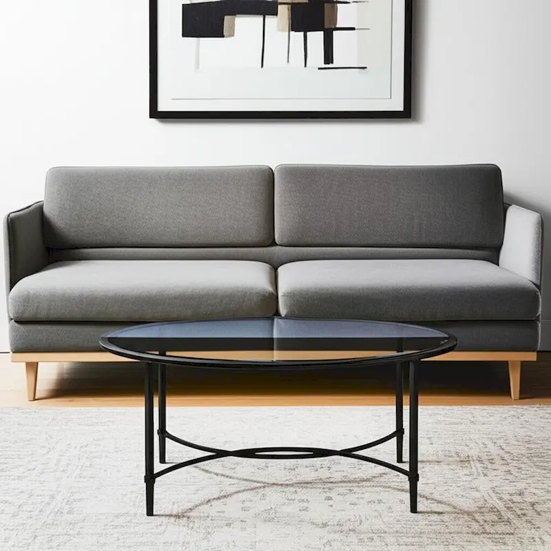 HomeRoots 45 Clear and Black Glass and Metal Oval Coffee Table - 19 H x 45 W x 25 D