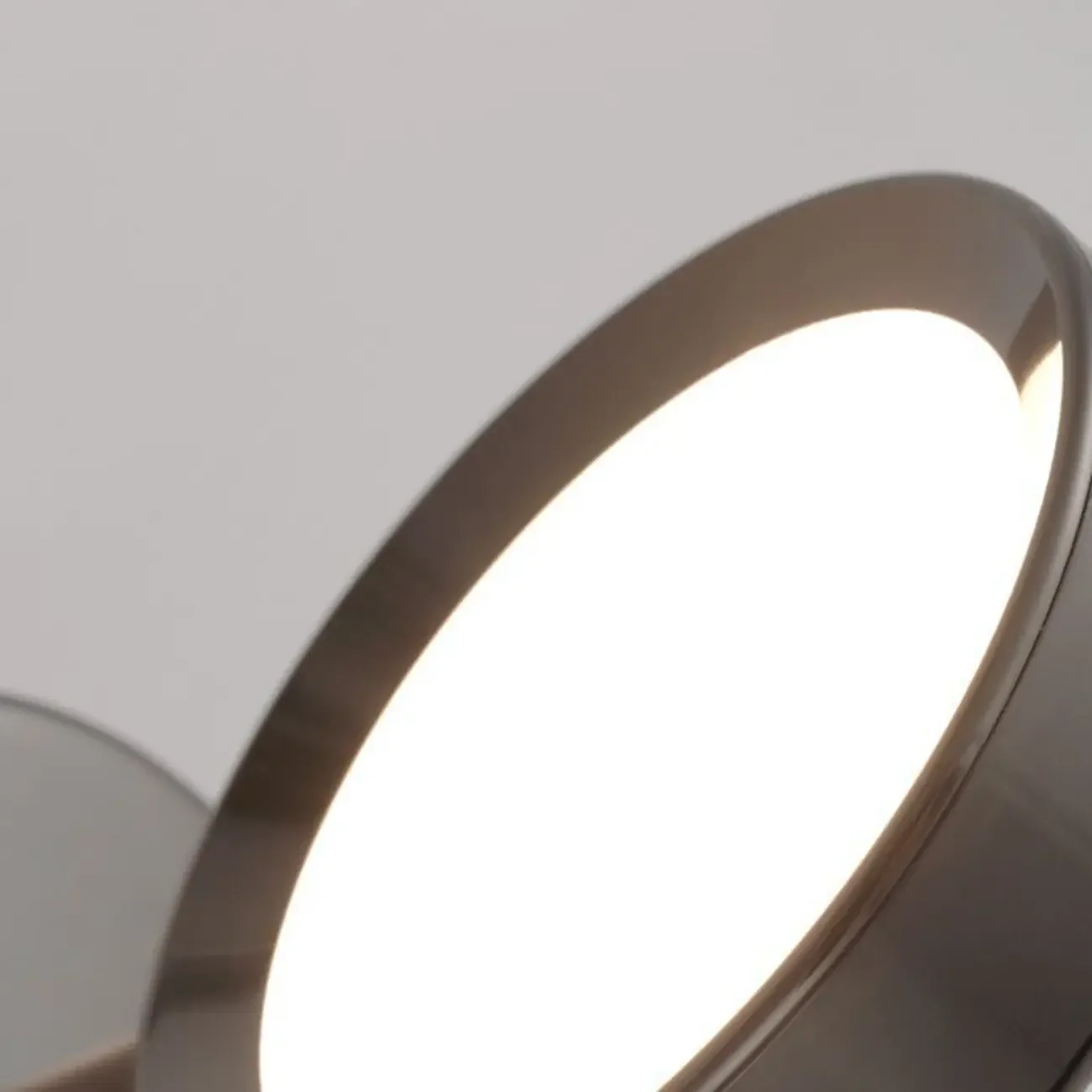 Modish Rotating Circular Chrome Wall Sconce