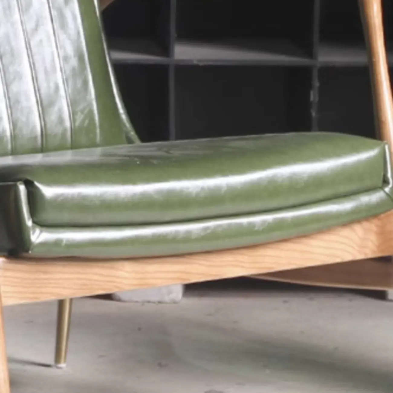 Modern Green Leather Armchair with High Back Design