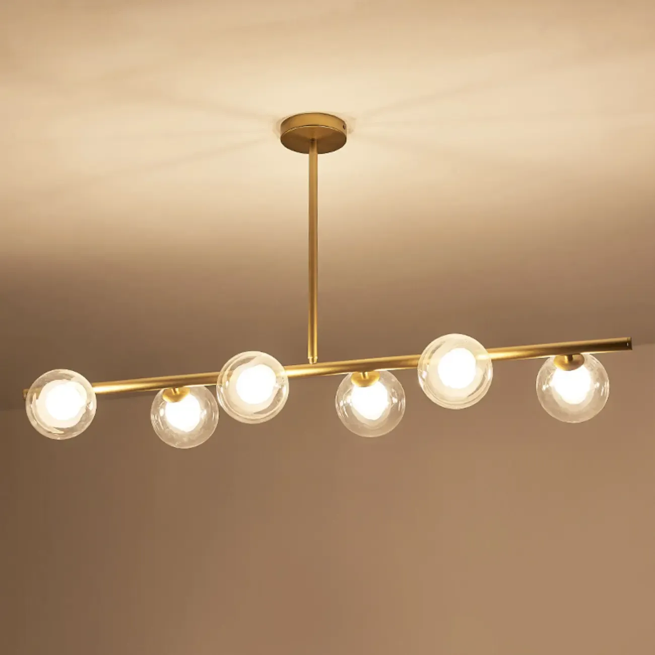 Gold Linear Island Light with 6 Lights Transparent Glass Globe Shades