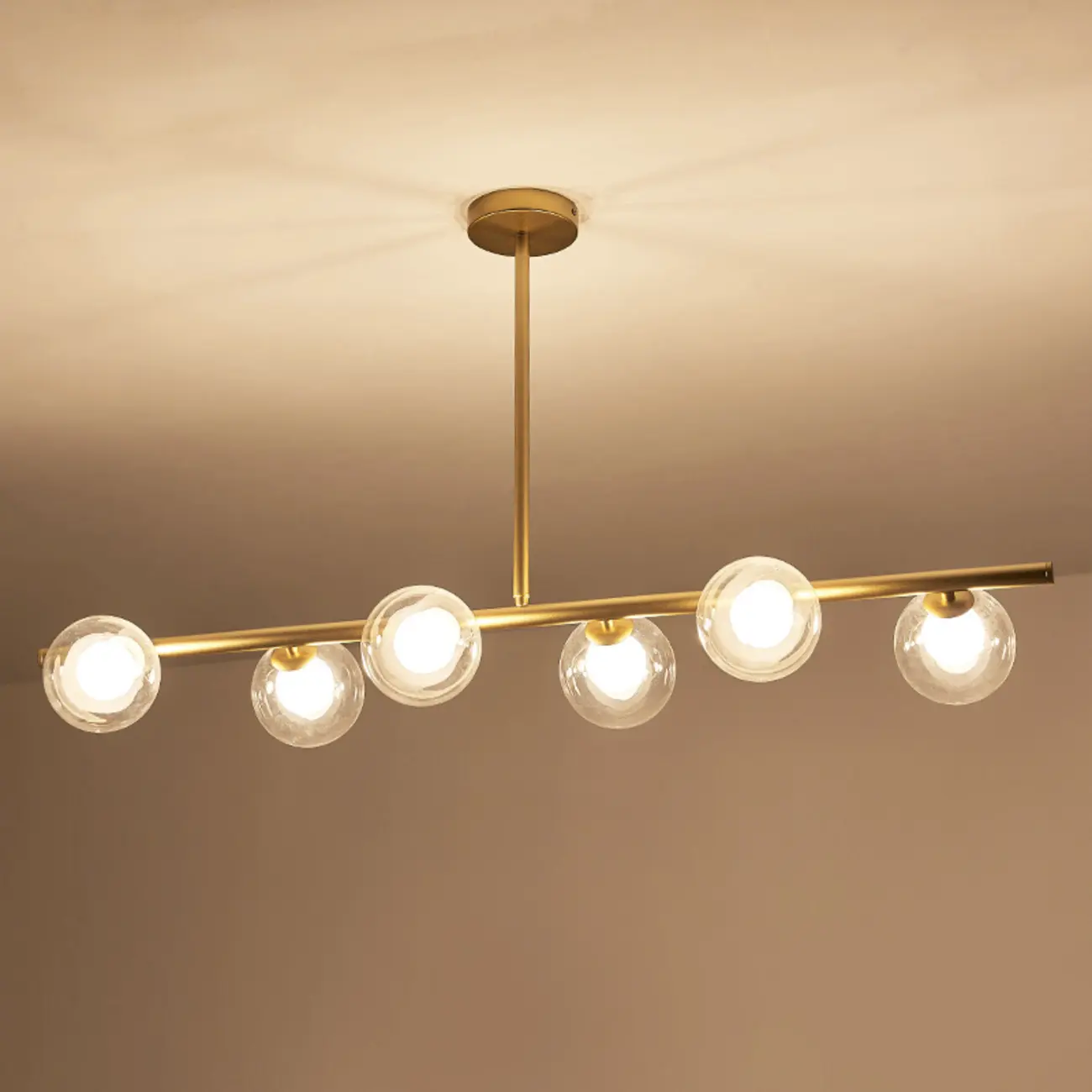 Gold Linear Island Light with 6 Lights Transparent Glass Globe Shades