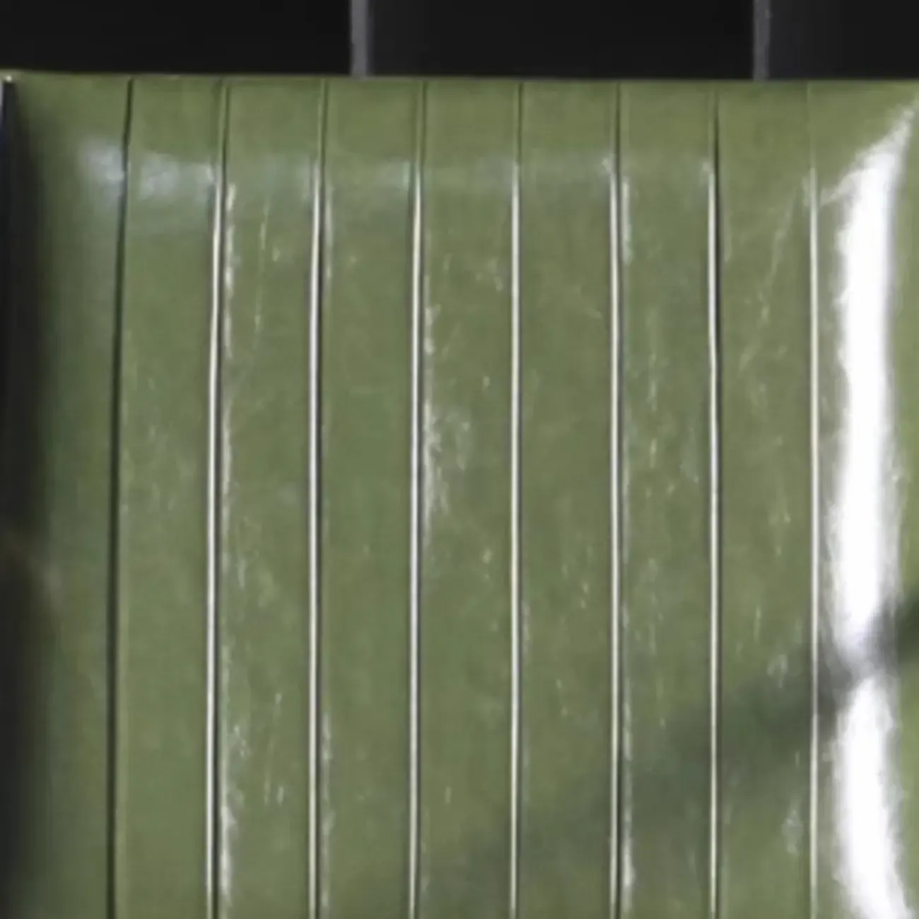 Modern Green Leather Armchair with High Back Design