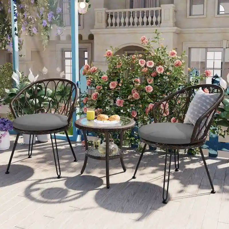 2 Rattan Single Chairs with A Glass Round Table