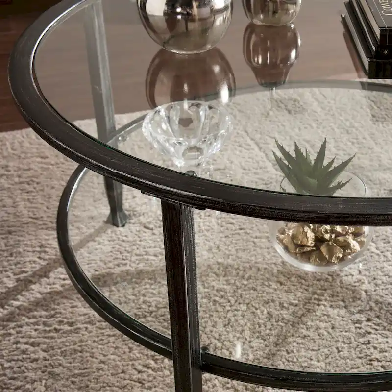 SEI Furniture Glenn Distressed Black Metal Round CoffeeTable with Glass Top and Shelf