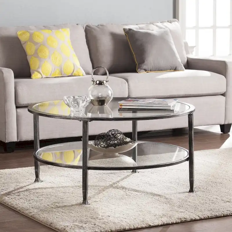 SEI Furniture Glenn Distressed Black Metal Round CoffeeTable with Glass Top and Shelf