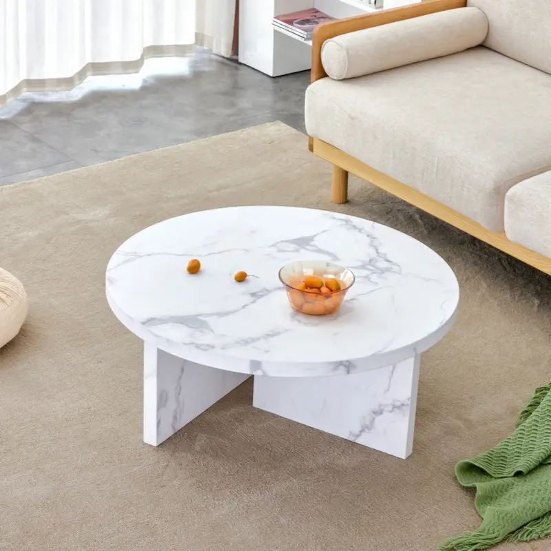 A white MDF material circular patterned coffee table suitable for small spaces and living rooms.