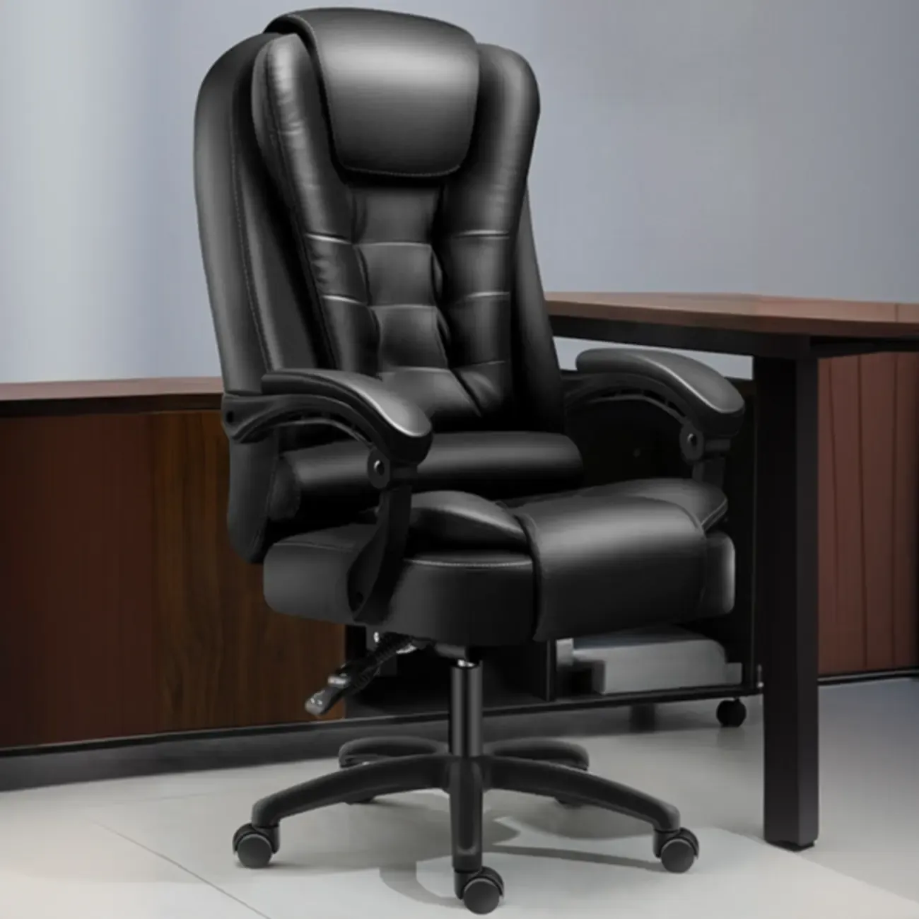 Ergonomic Black Leather Swivel Office Chair with Footrest