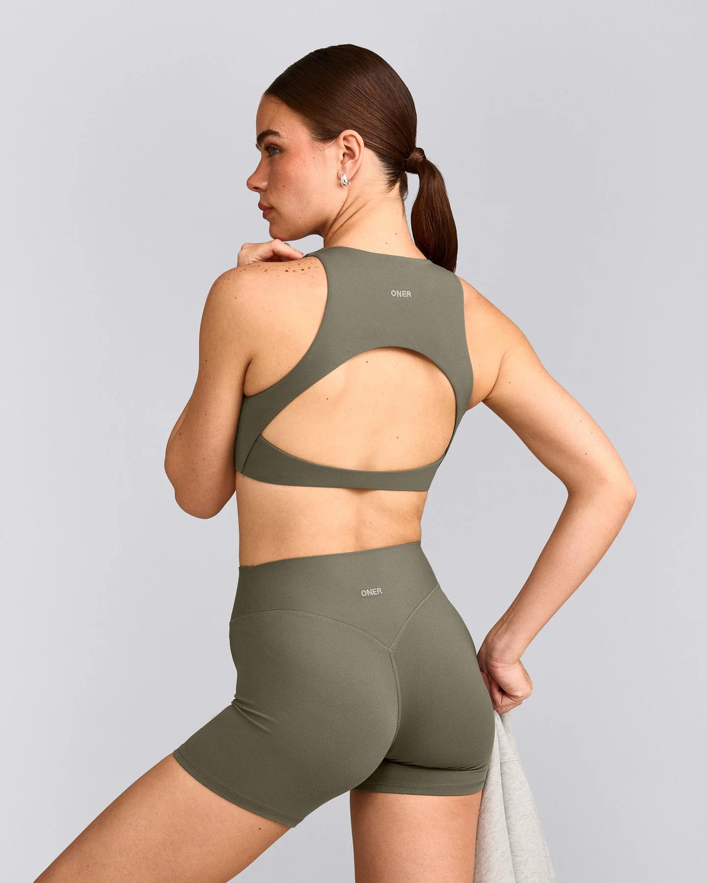 SoftMotion™ High Neck Sports Bra with Grey Logo | Alpine Green