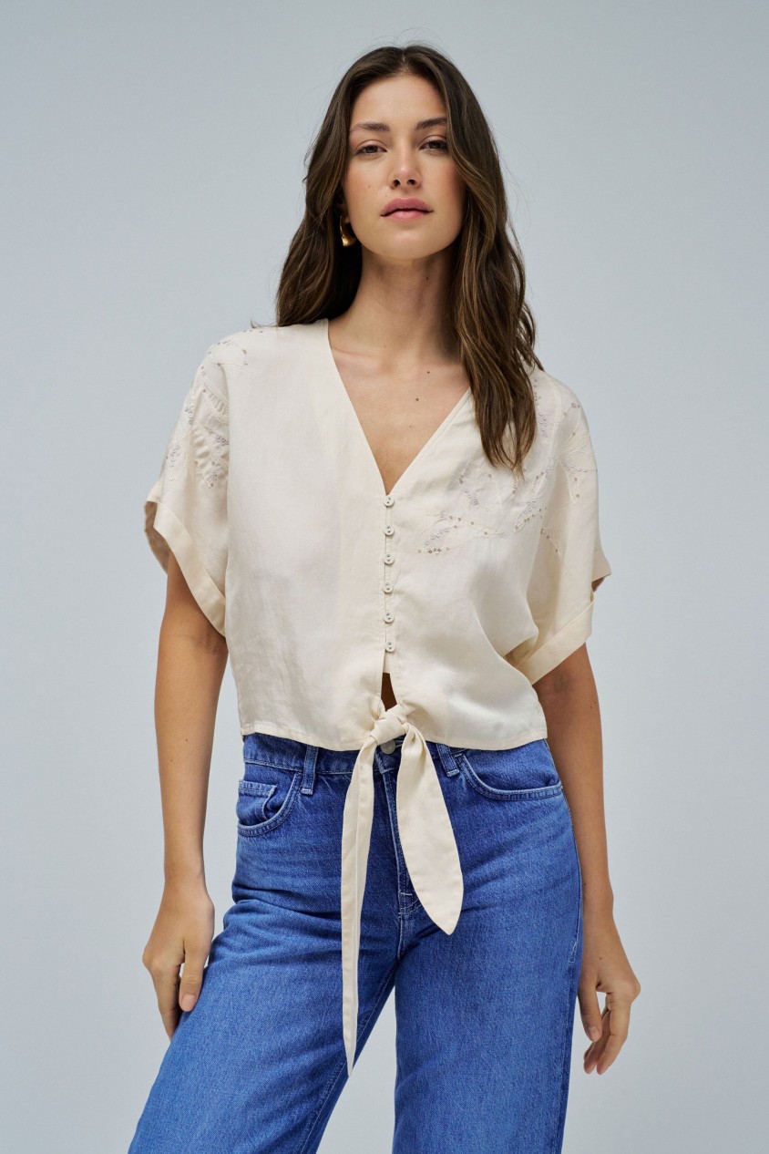 LIGHTDENIM BLOUSE WITH BOW AT THE HEM