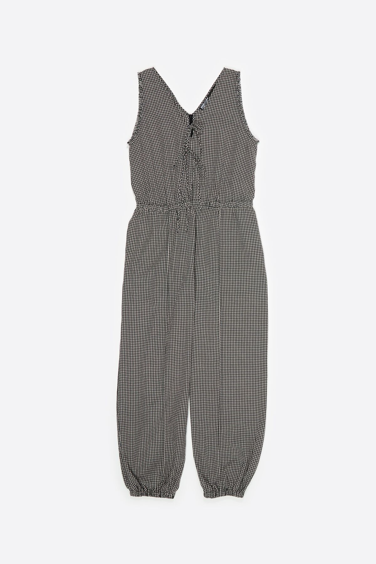 Black checked baggy jumpsuit with bows and frayed details