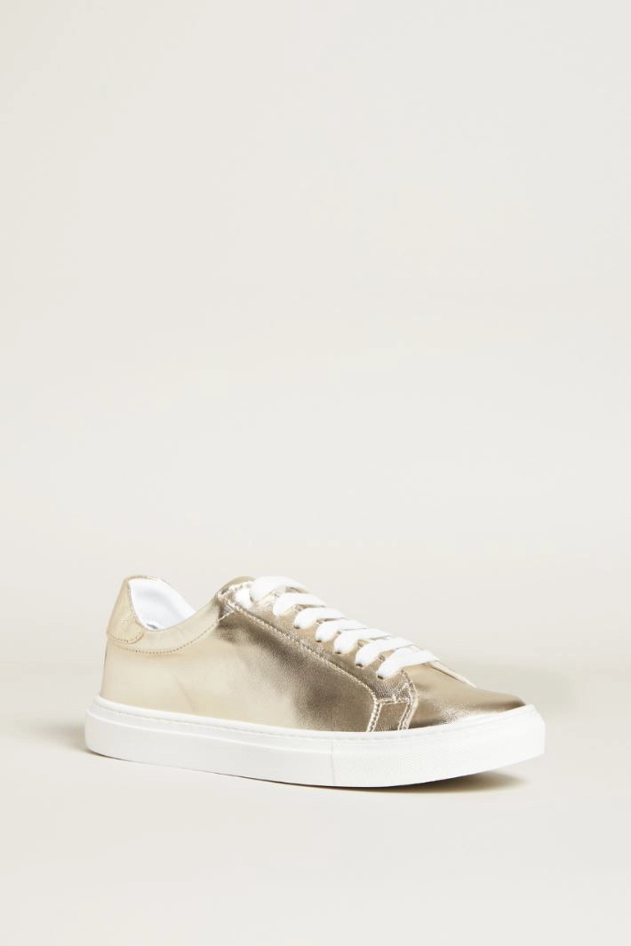Laminated leather sneakers - GOLD