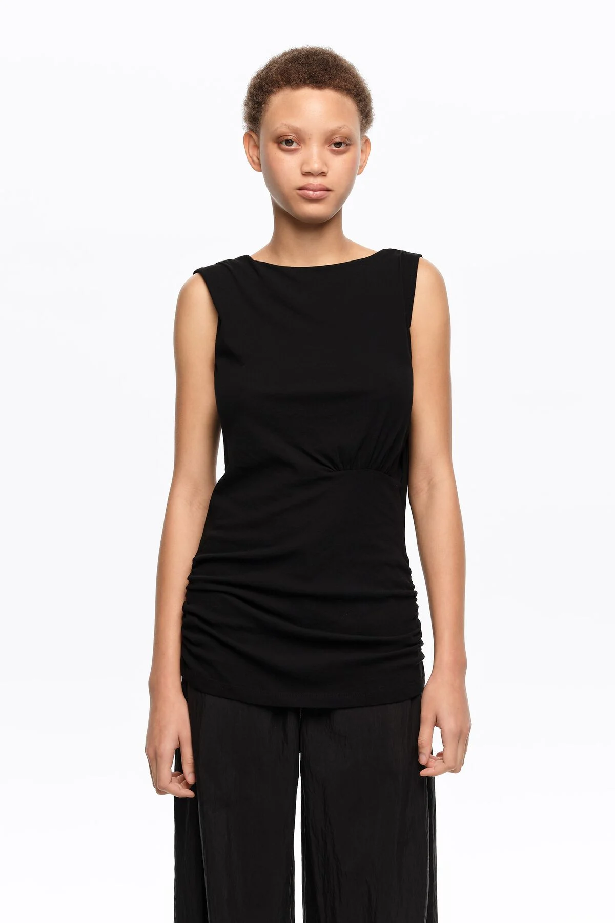 Black fitted elasticated top with dropped back