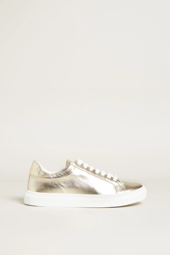 Laminated leather sneakers - GOLD