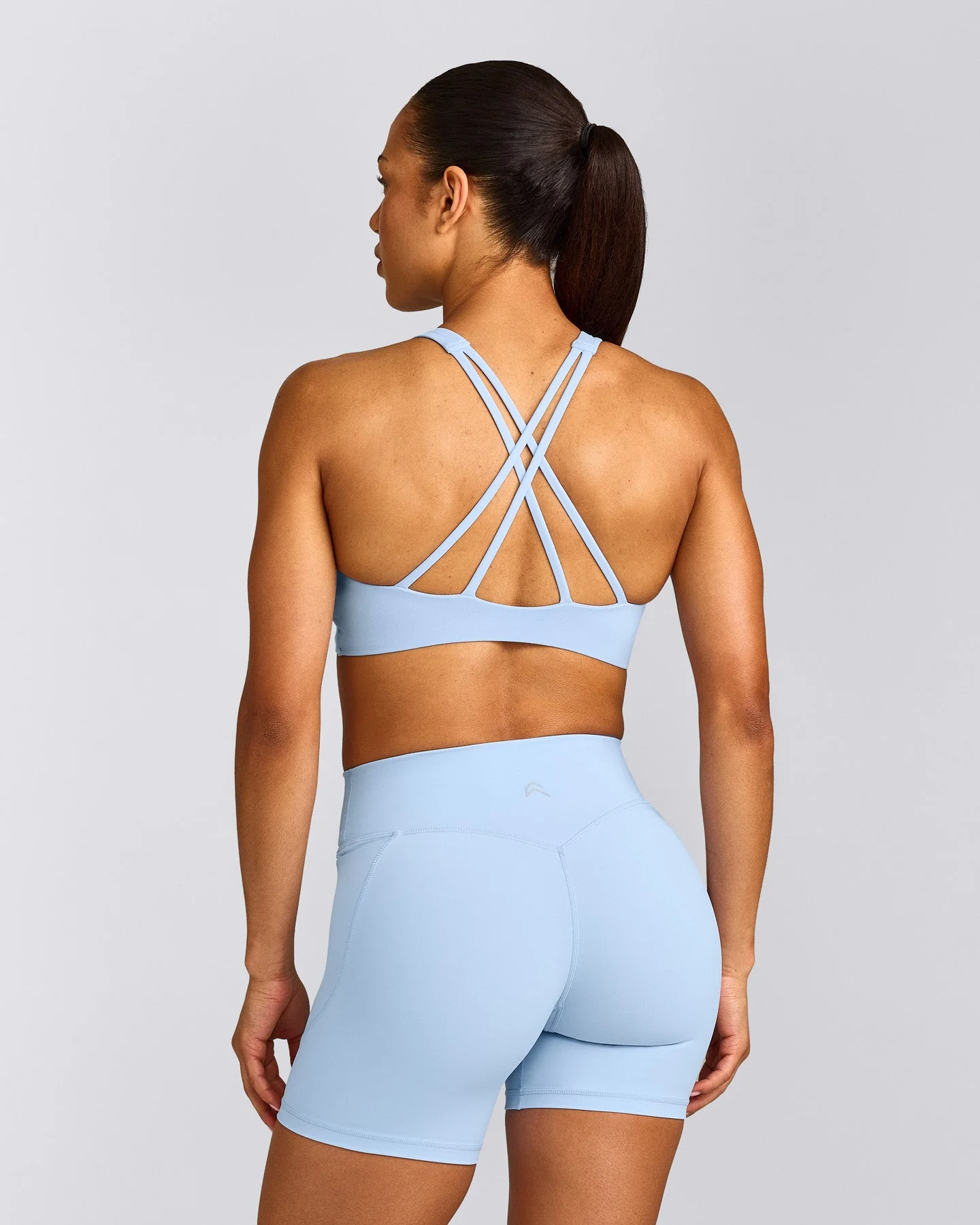 EasyLift™ High Neck Sports Bra with Grey Logo | Powdered Blue