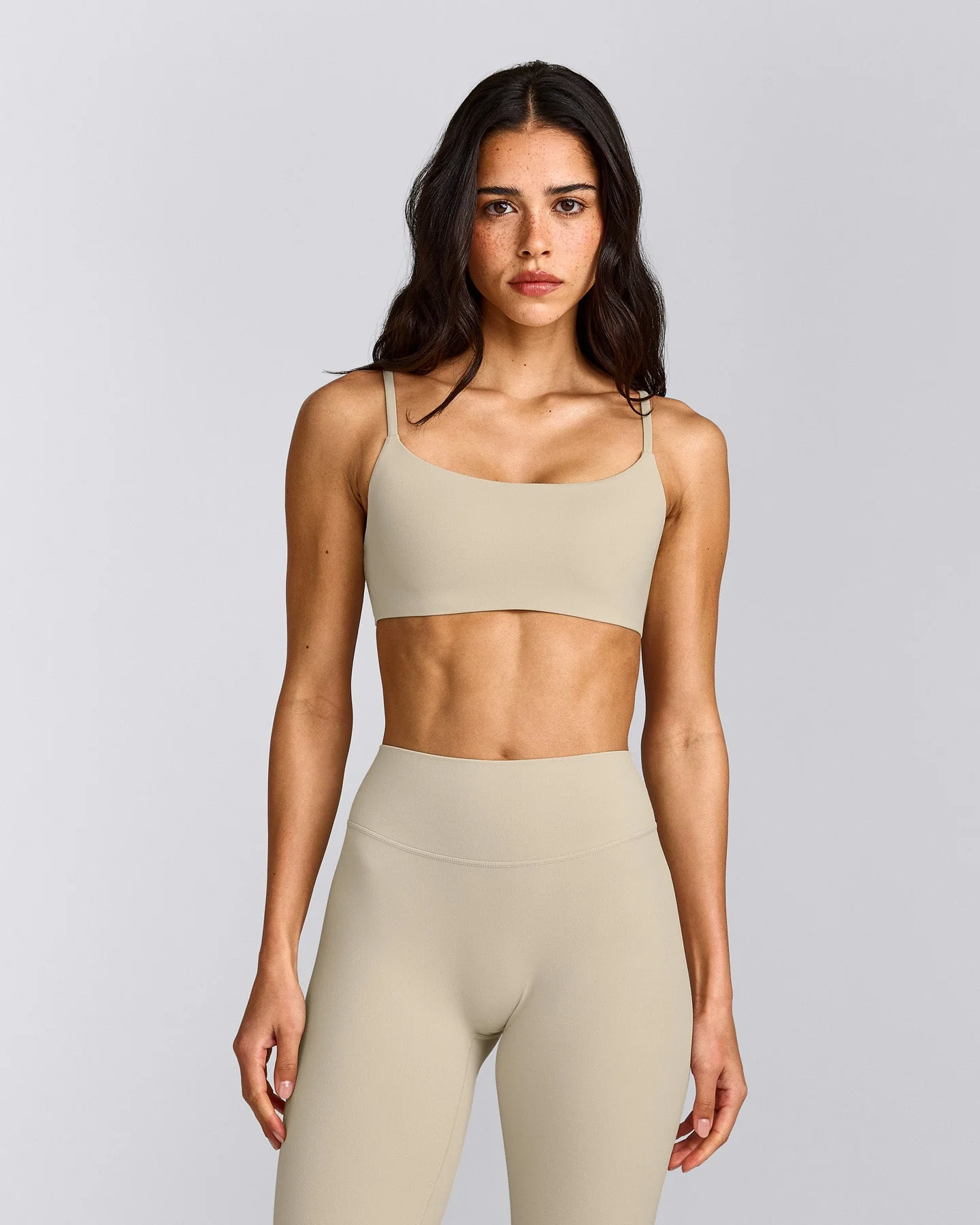 SoftMotion™ Strappy Sports Bra with Grey Logo | Oatmeal