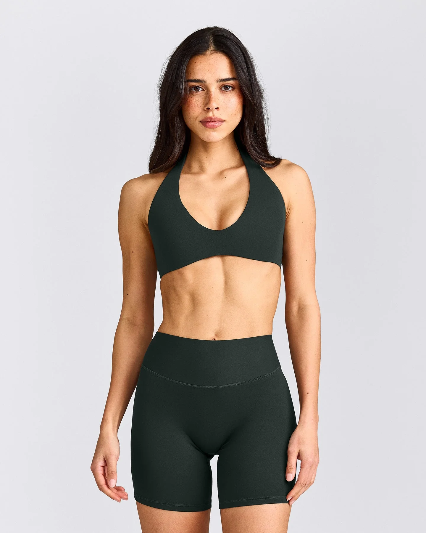 SoftMotion™ Minimal Halter Neck Bralette with Grey Logo | Emerald Noir