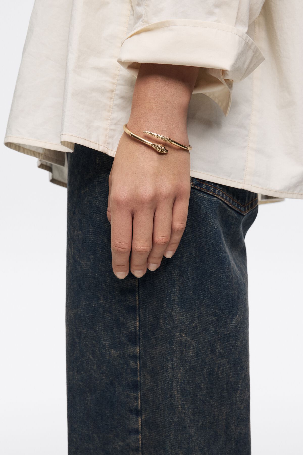 Aged gold rigid textured snake bracelet