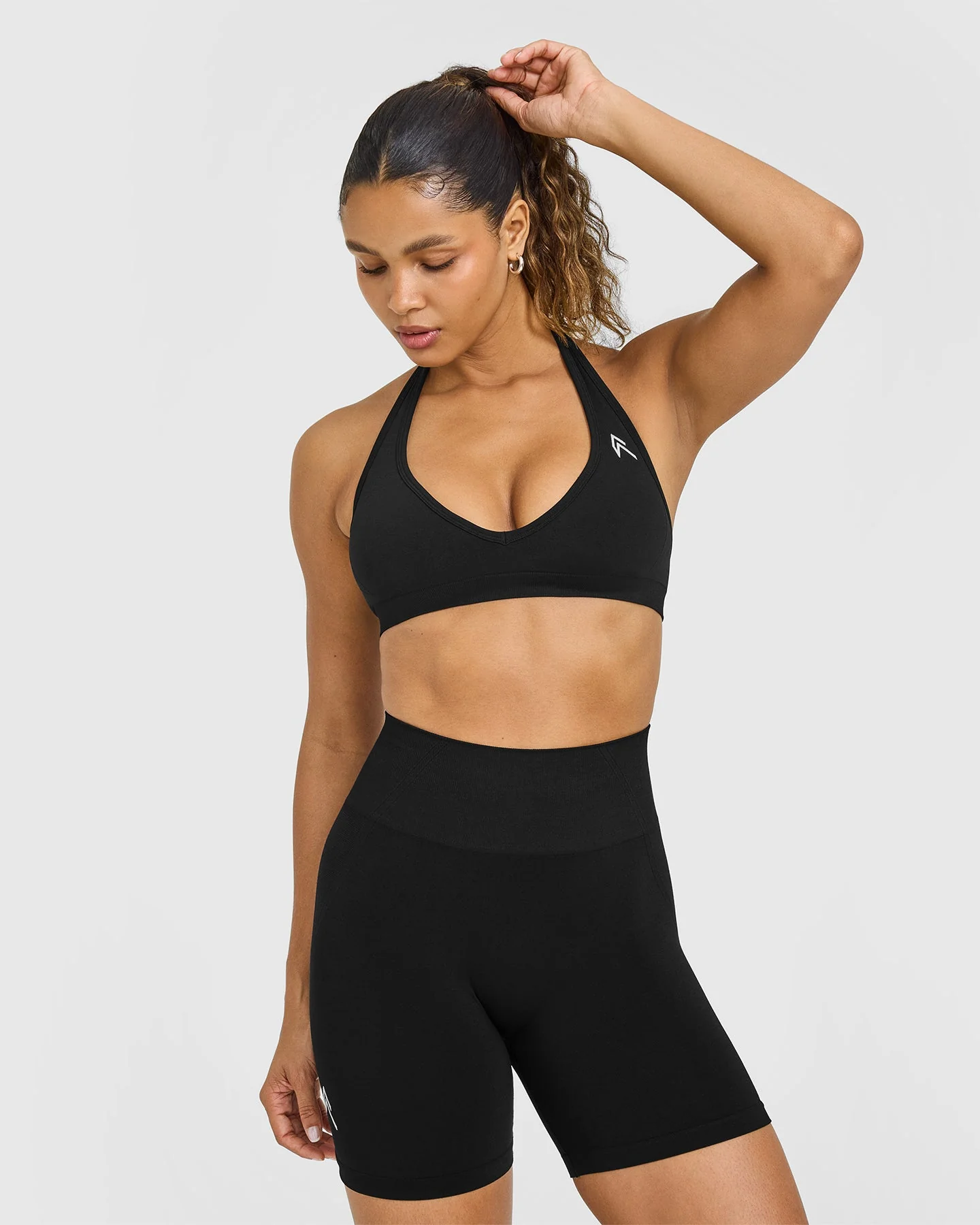 EffortlessLift™ Seamless Halter Neck Sports Bra with White Logo | Black
