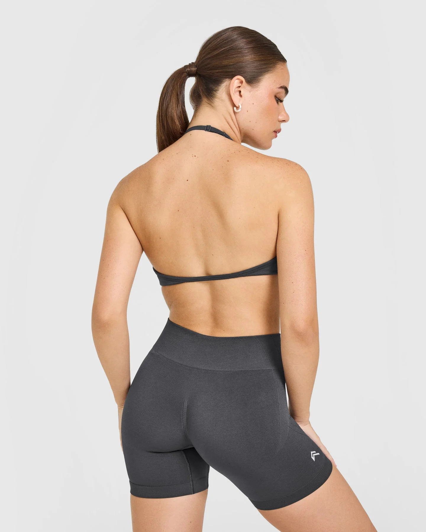 EnhanceLift™ Seamless Minimal Halter Neck Bralette with White Logo | Coal