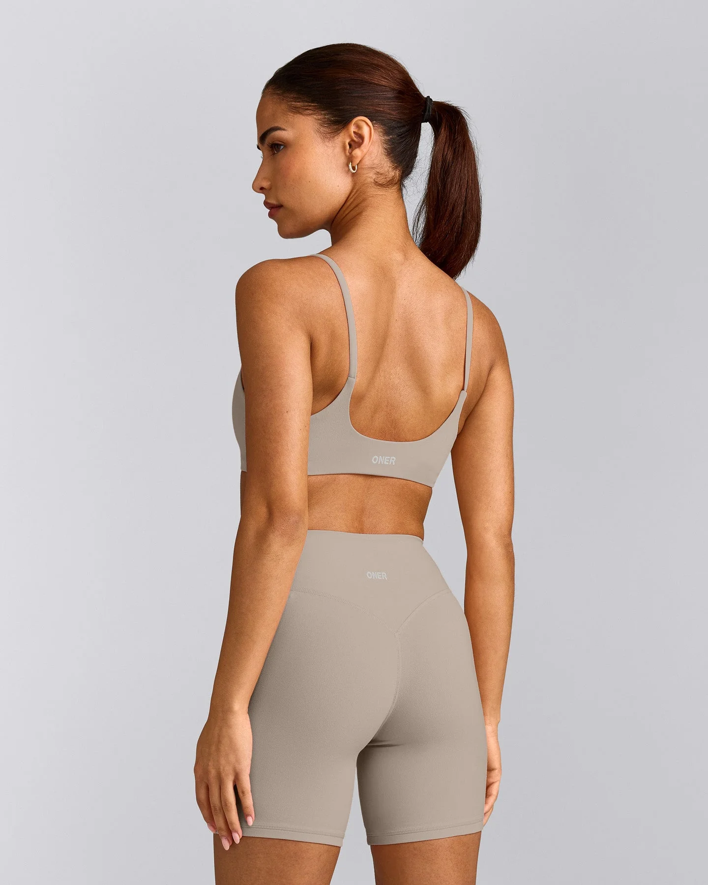 SoftMotion™ Strappy Sports Bra with White Logo | Warm Sand