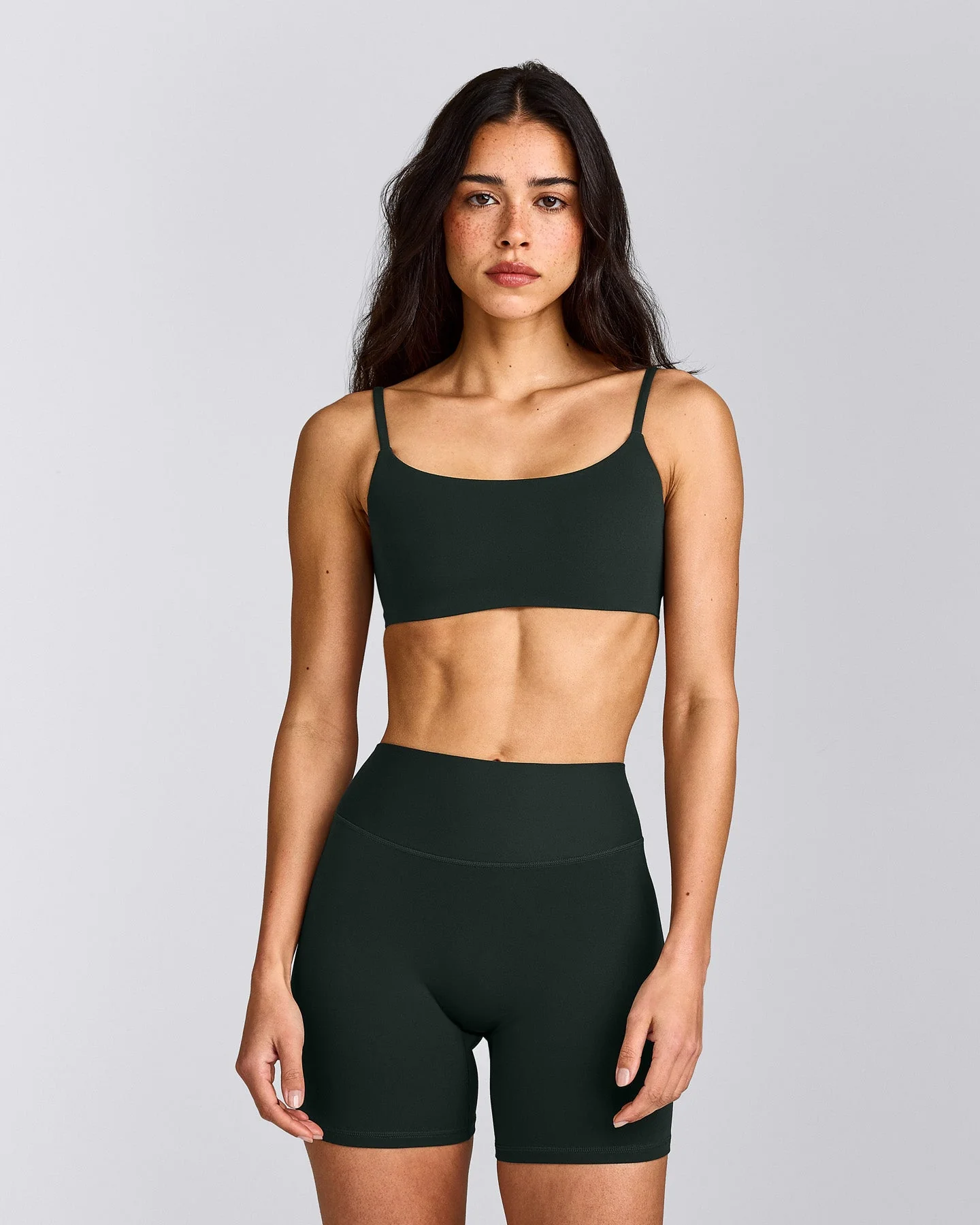 SoftMotion™ Strappy Sports Bra with Grey Logo | Emerald Noir