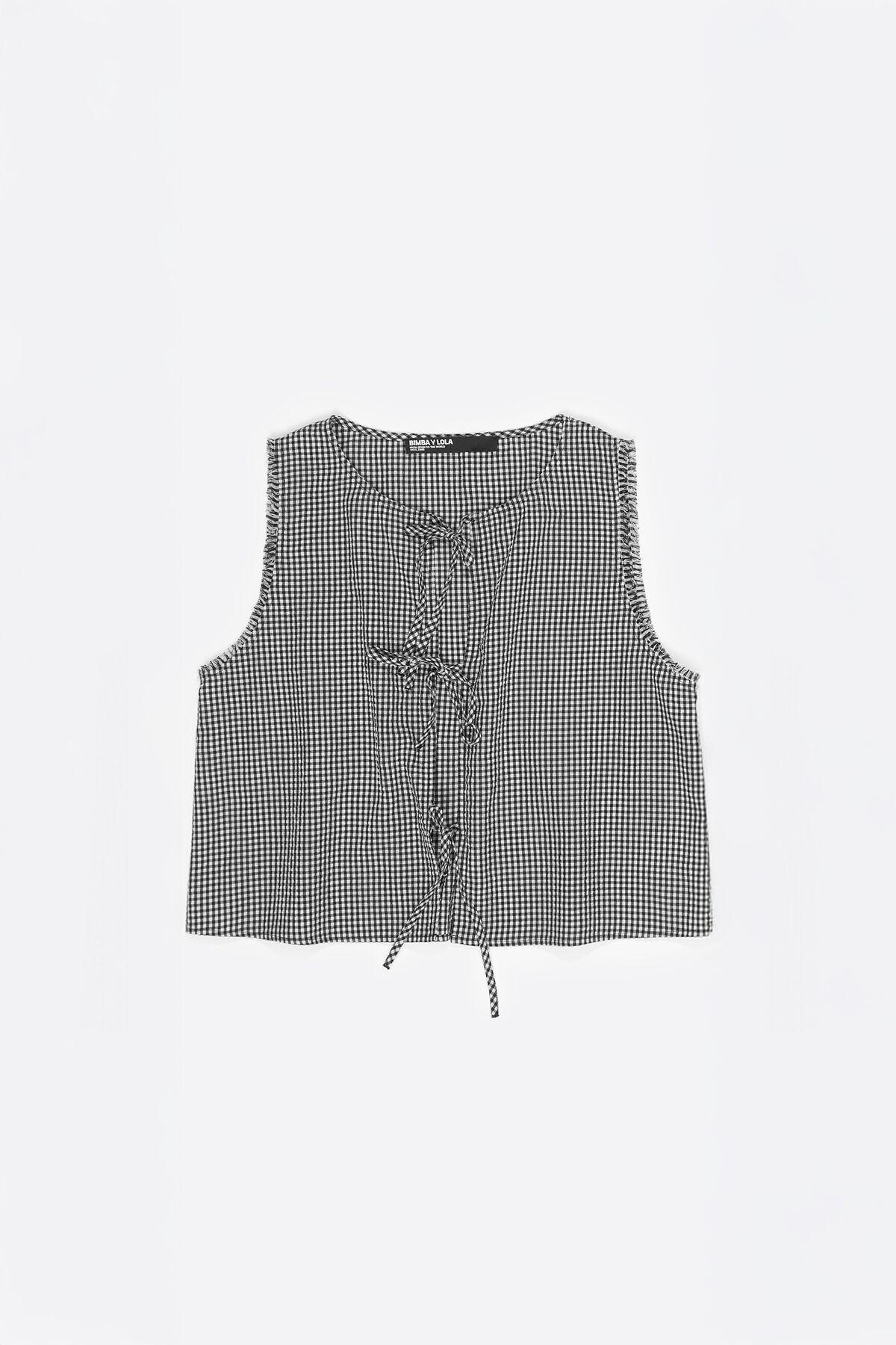 Black checked top with bows and frayed details