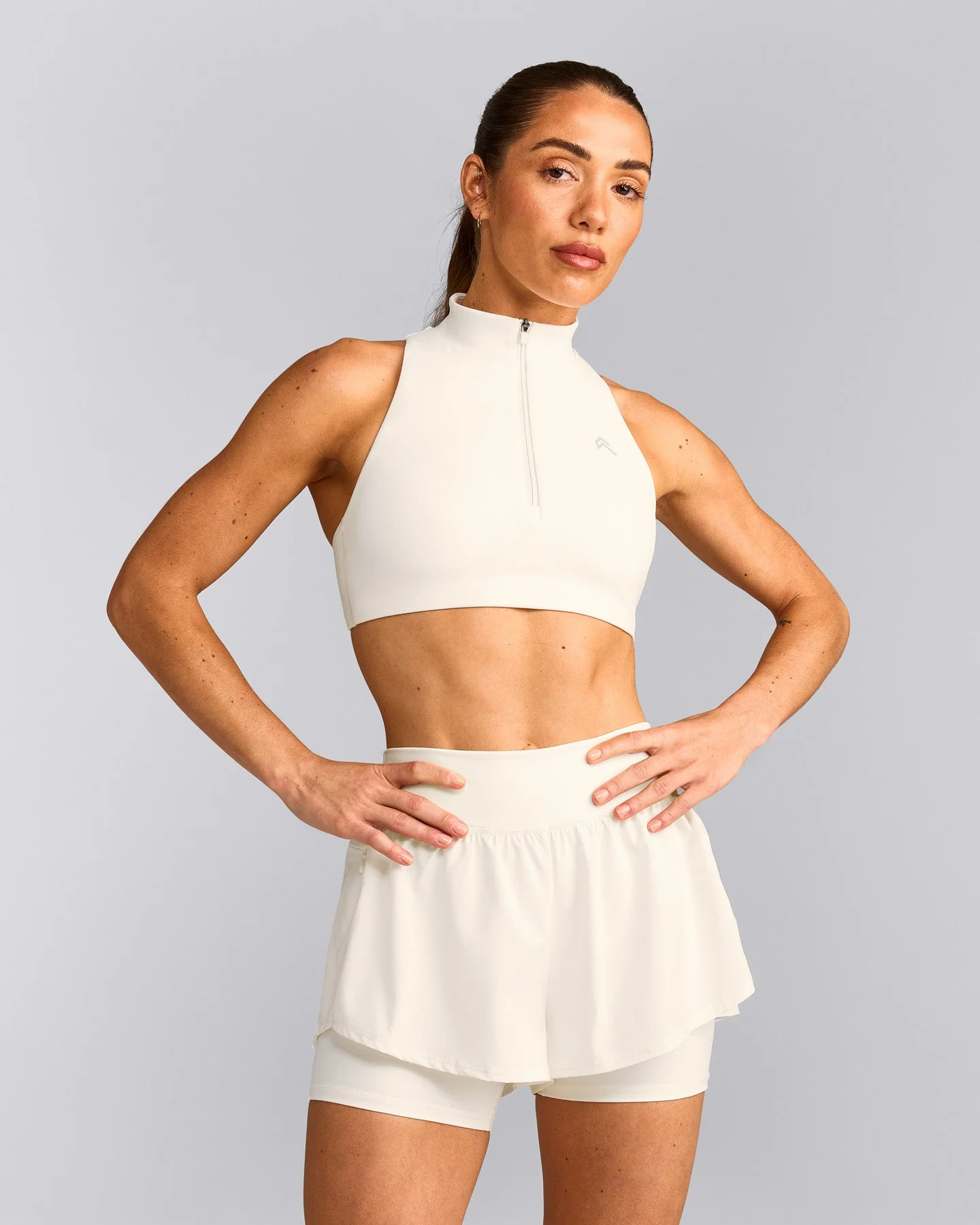 EasyLift™ Zip High Neck Sports Bra with Grey Logo | Marshmallow White