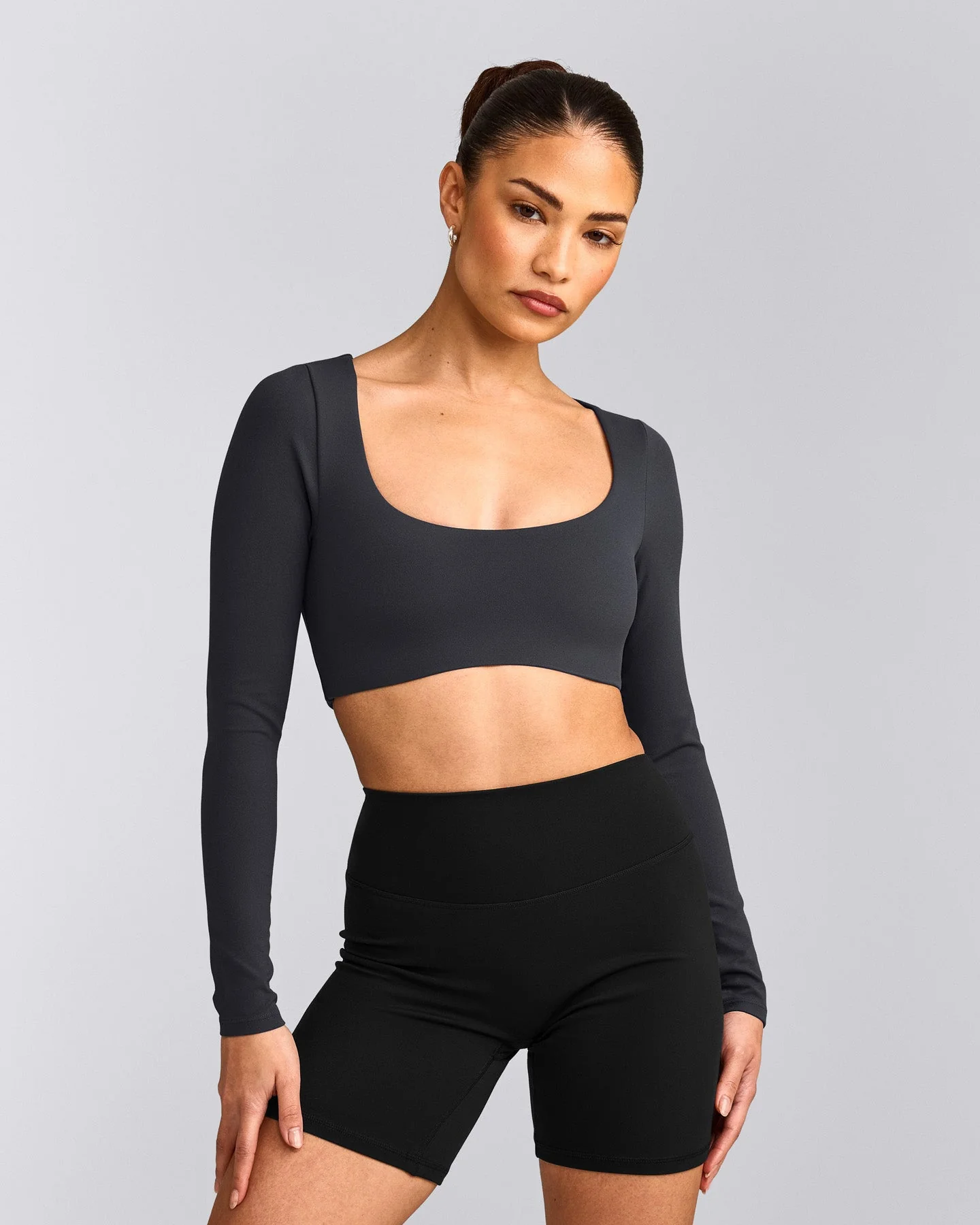SoftMotion™ Scoop Neck Long Sleeve Crop Top with Built in Bra Shelf with Grey Logo | Coal