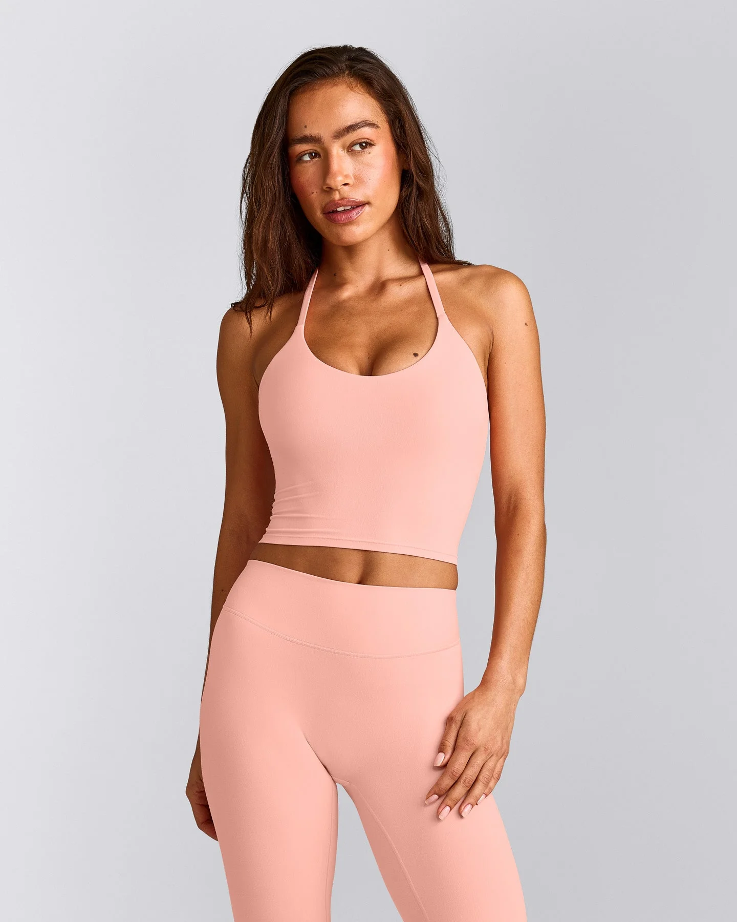SoftMotion™ Strappy Halter Neck Mid Vest with Built in Bra Shelf with Grey Logo | Peach Orange