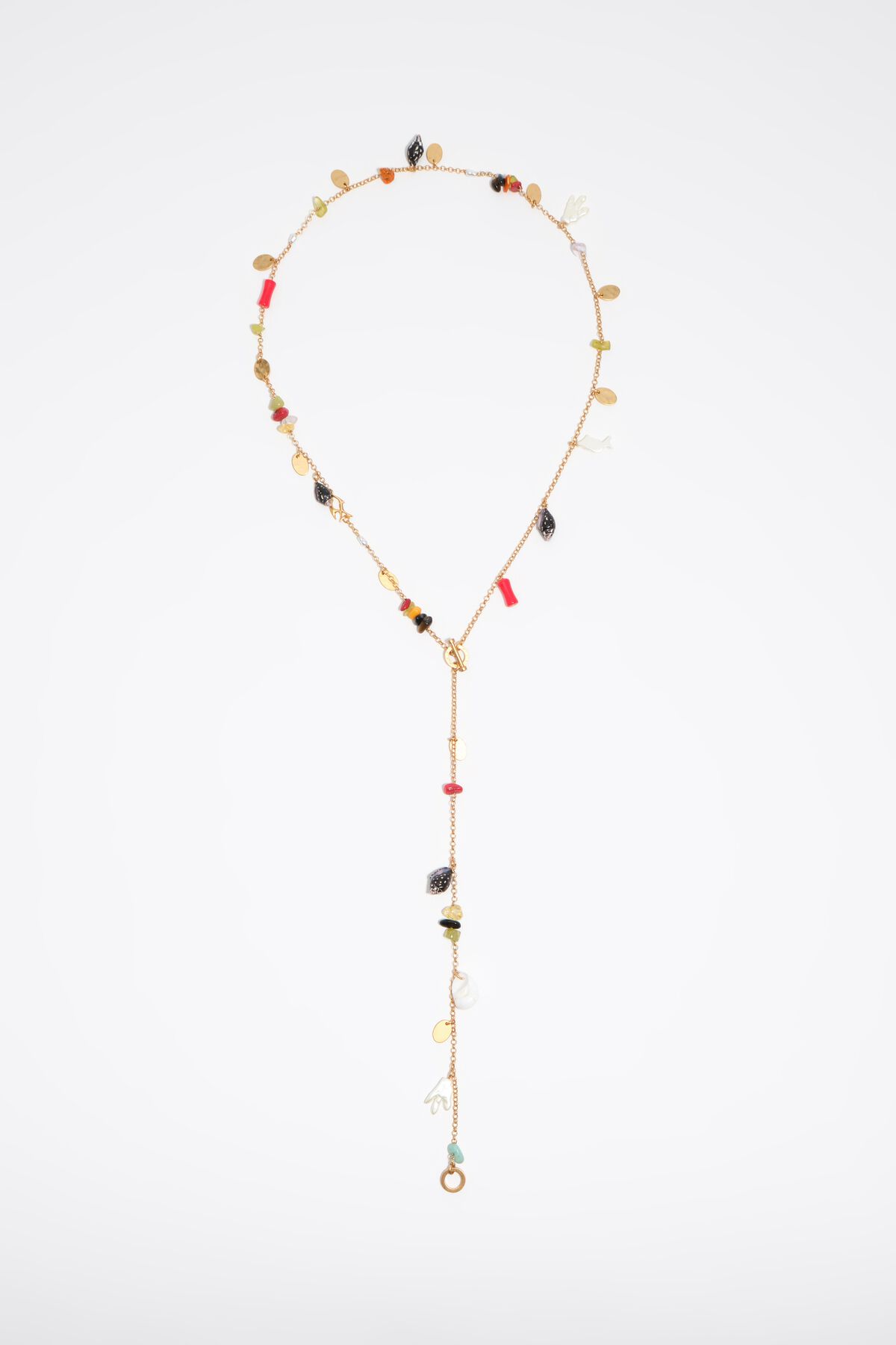 Aged gold necklace with stones and shells