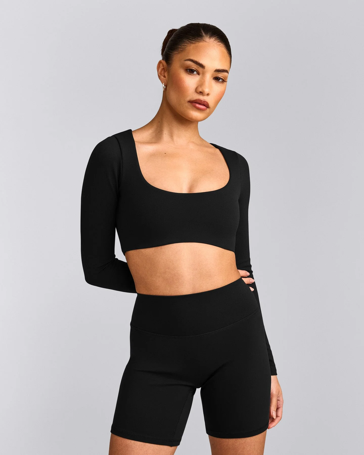 SoftMotion™ Scoop Neck Long Sleeve Crop Top with Built in Bra Shelf with Grey Logo | Black