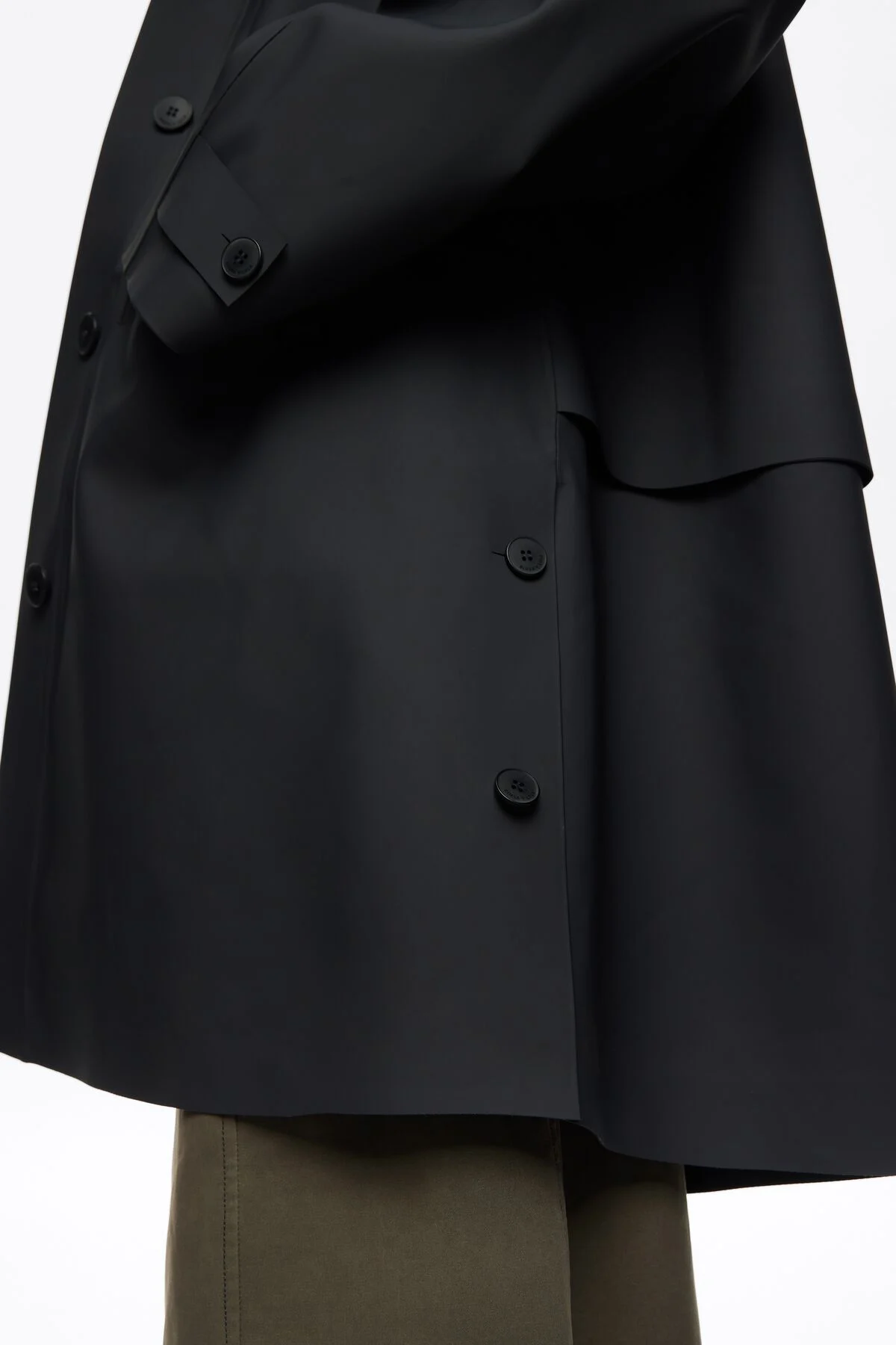 Dark blue rubberized A-line trench