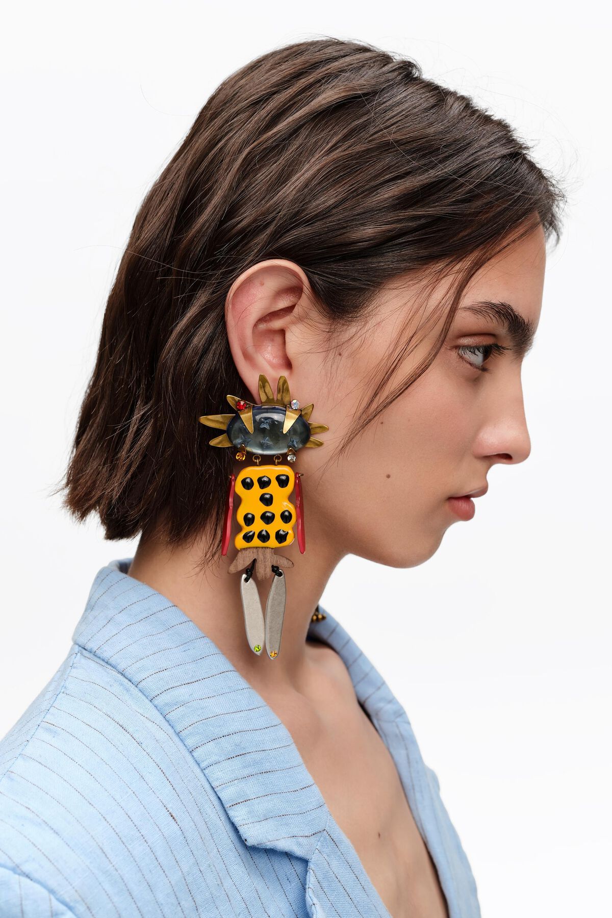 Aged gold dancer earrings