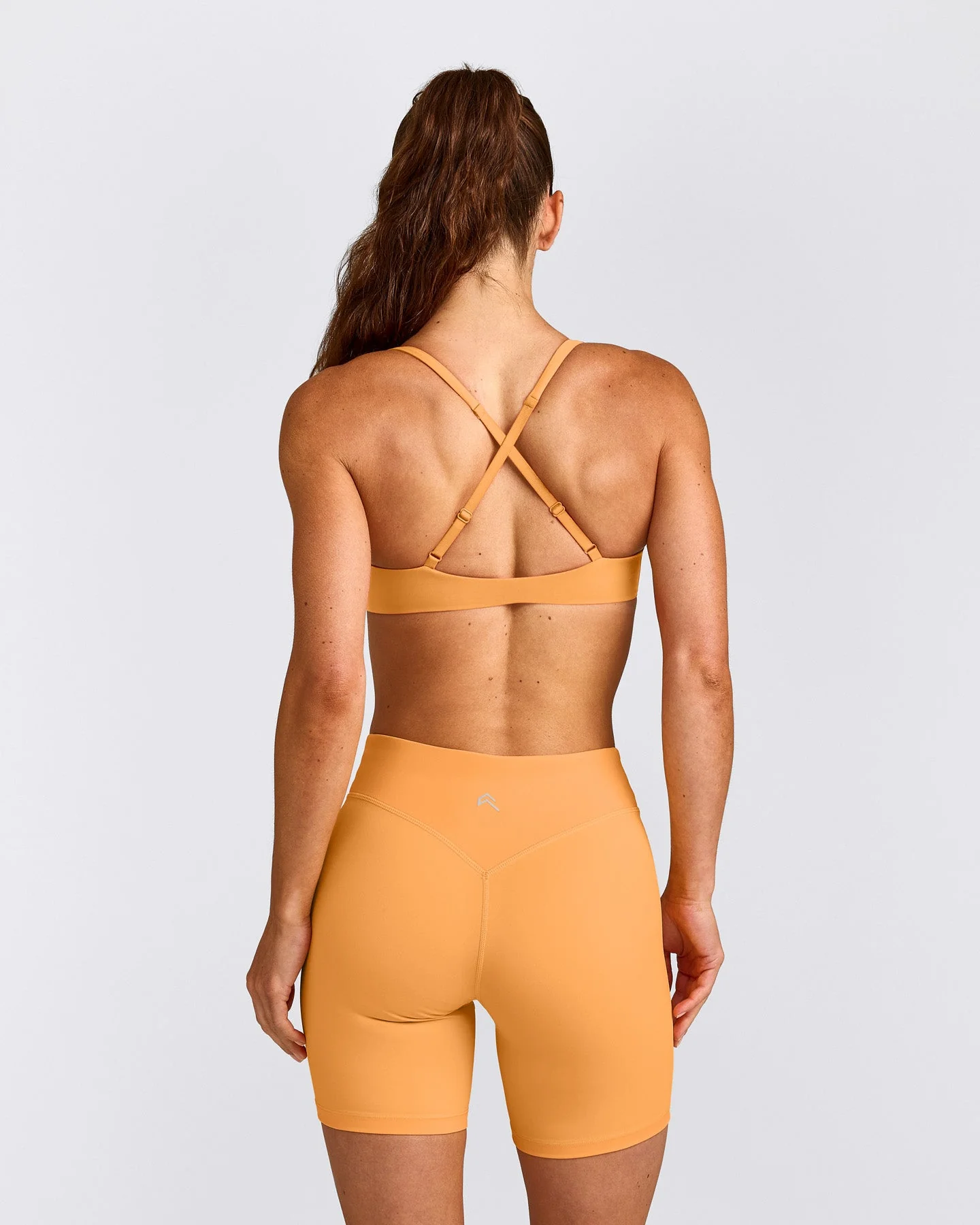 UnifiedMove™ Cross Back Sports Bra with Reflective Logo | Powdered Orange