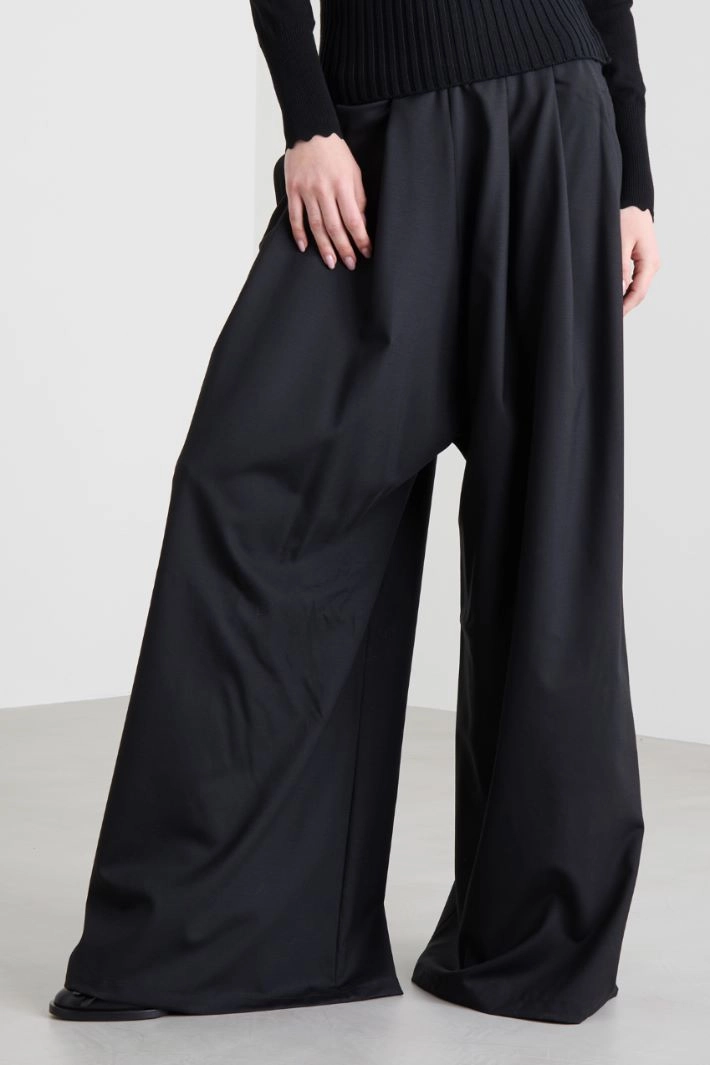 Knitted peplum trousers - BLACK