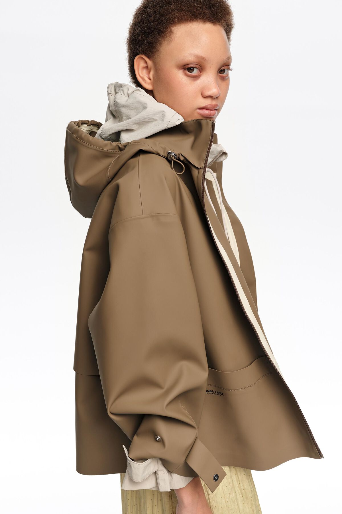 Dark camel rubberized A-line trench