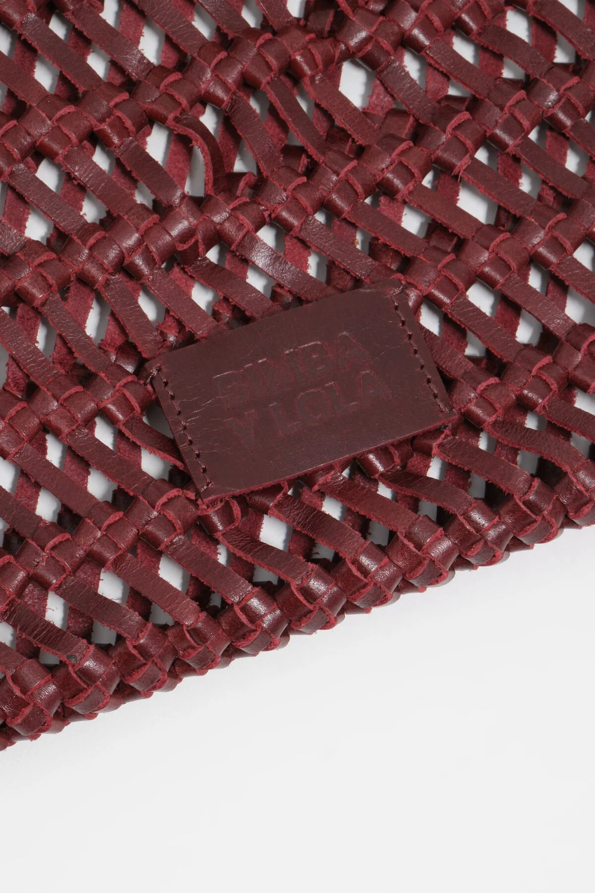 Dark cherry plaited leather handbag