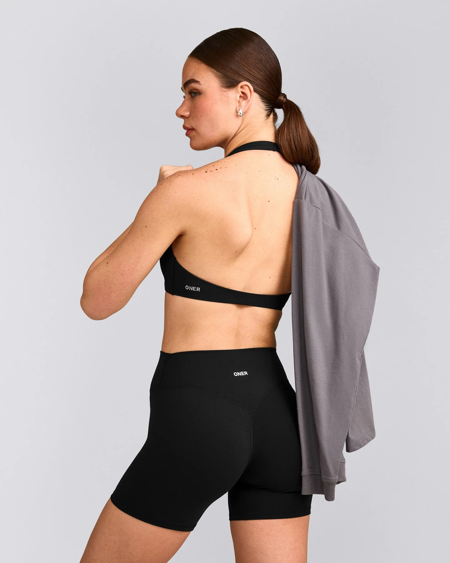 SoftMotion™ Minimal Halter Neck Bralette with Grey Logo | Black