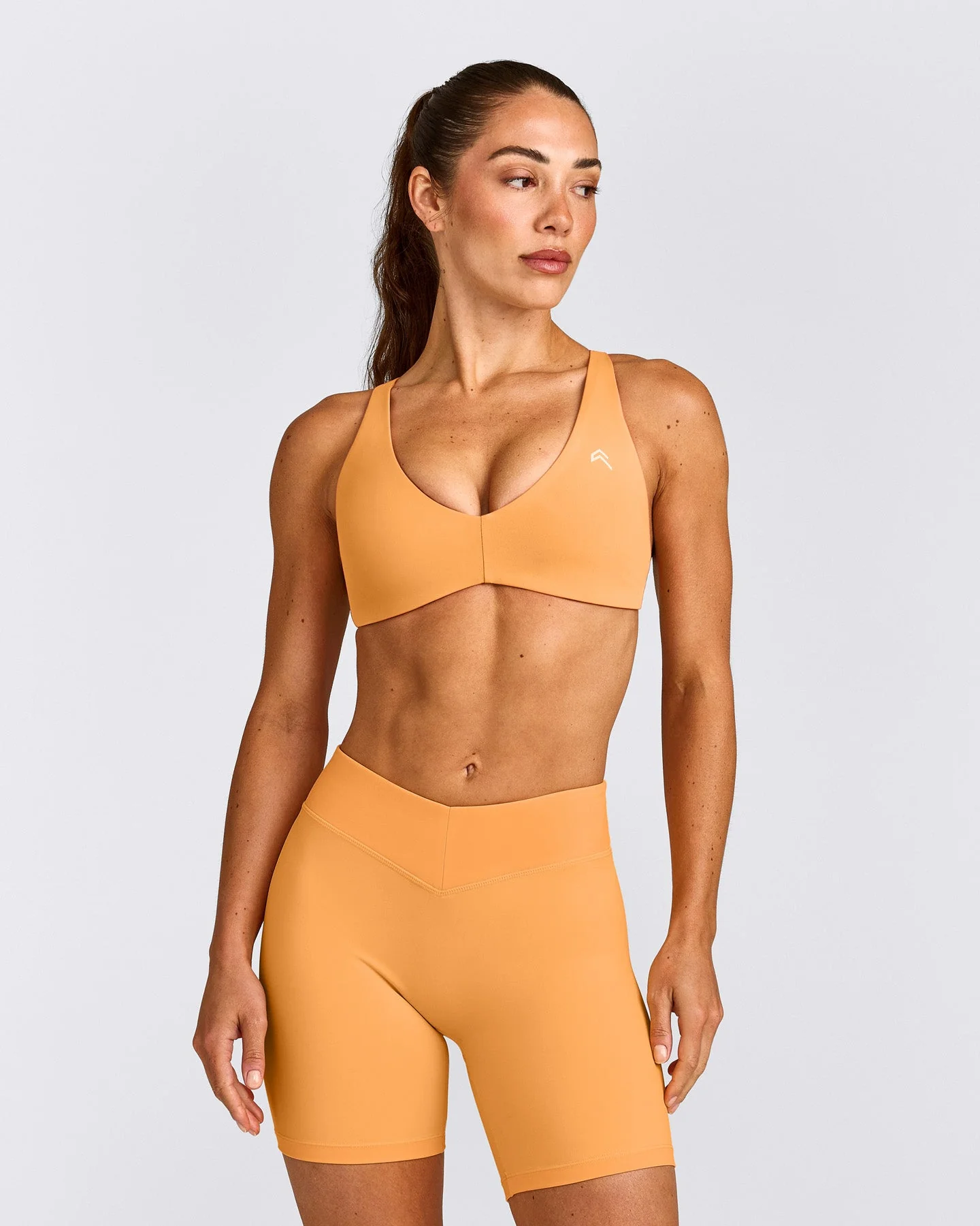 UnifiedMove™ Cross Back Sports Bra with Reflective Logo | Powdered Orange
