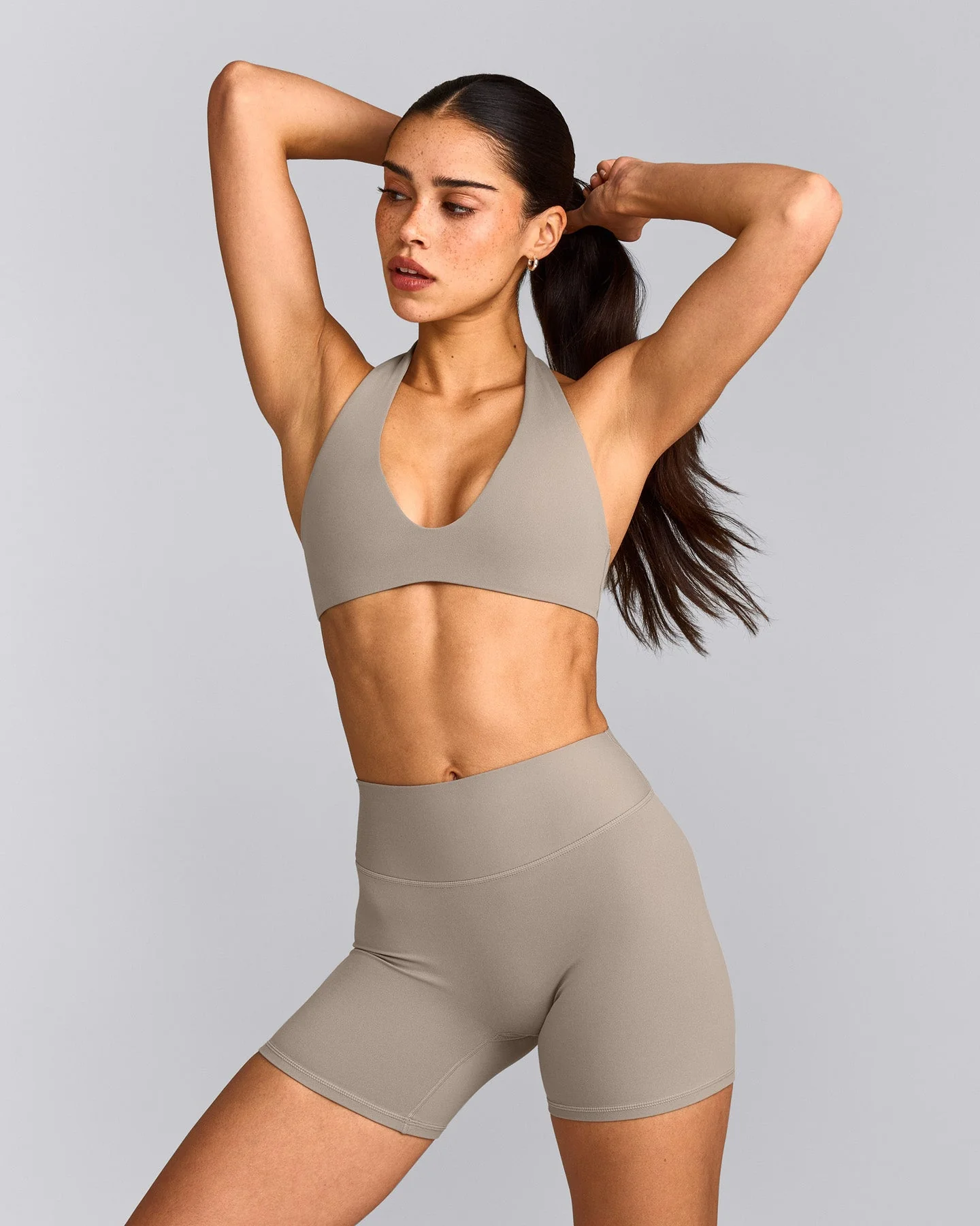 SoftMotion™ Minimal Halter Neck Bralette with White Logo | Warm Sand