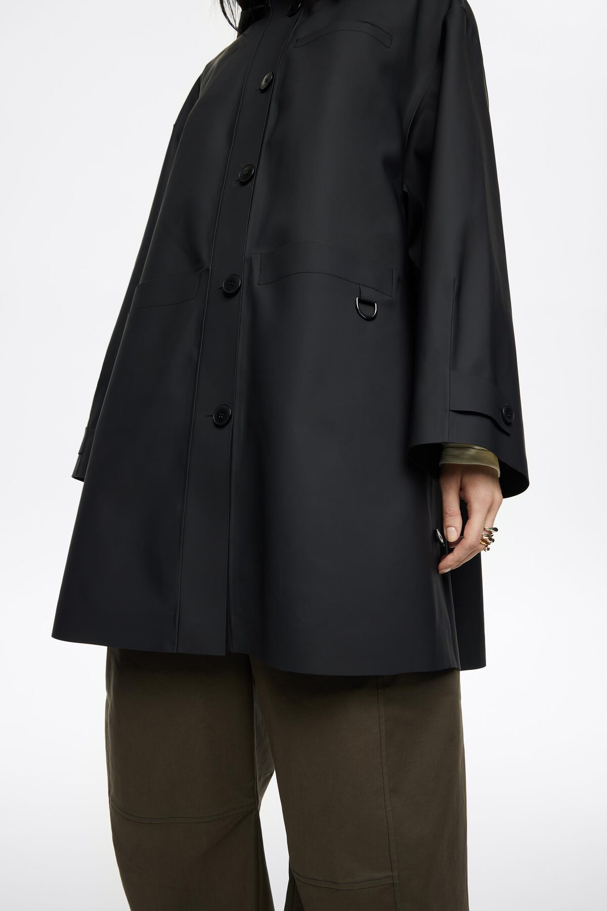 Dark blue rubberized A-line trench