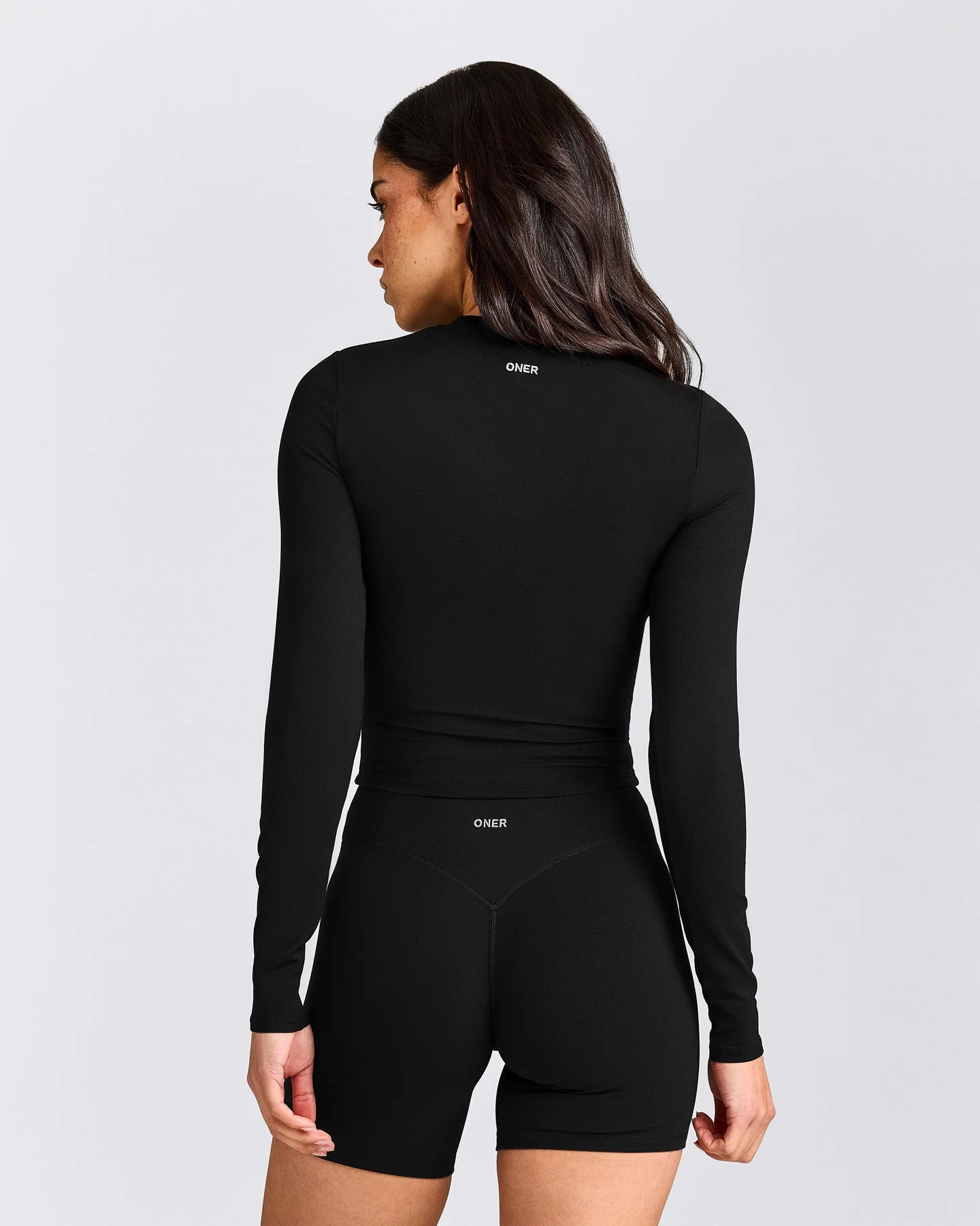 SoftMotion™ Long Sleeve Mid Top with Grey Logo | Black