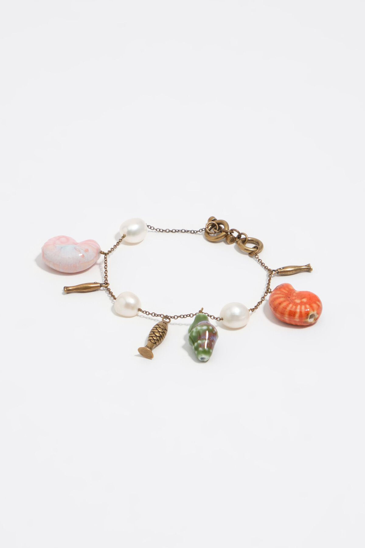 Aged gold bracelet with pearls, shells and fish