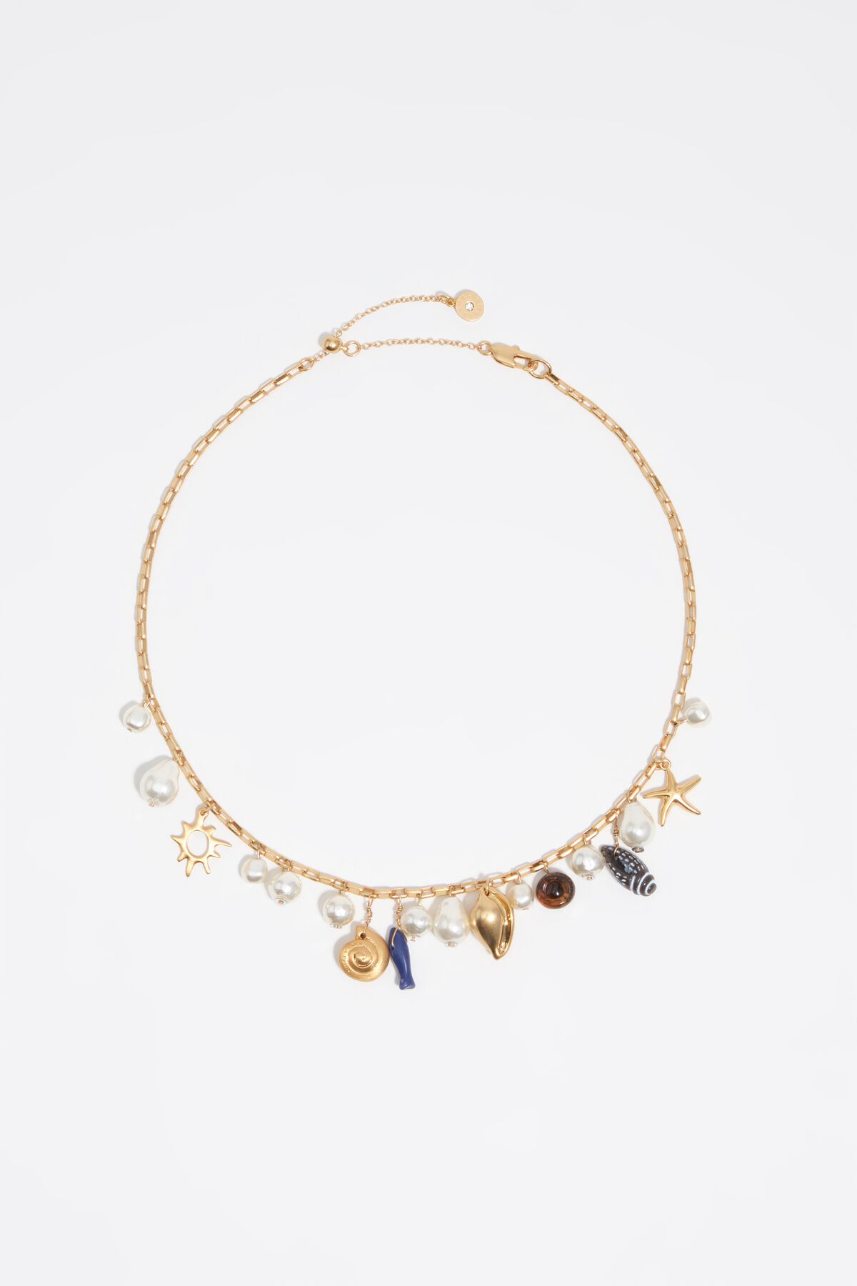 Aged gold necklace with shells and fish