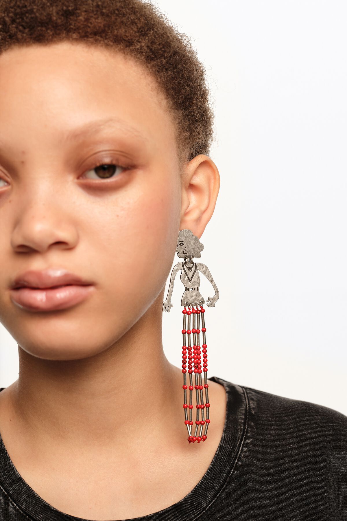 Aged silver metal silhouette and stones earrings
