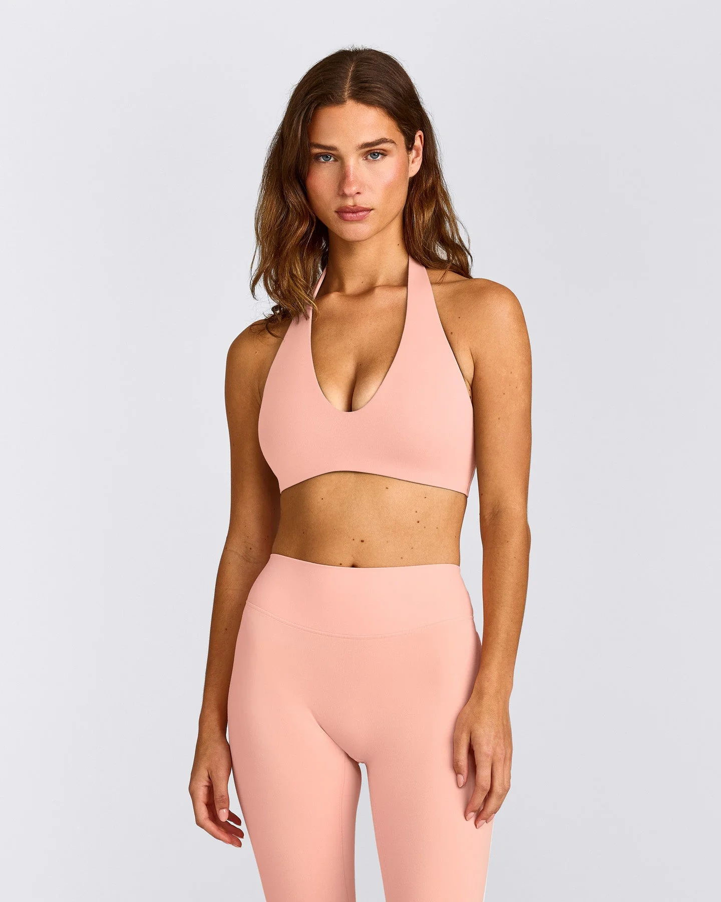 SoftMotion™ Minimal Halter Neck Bralette with Grey Logo | Peach Orange