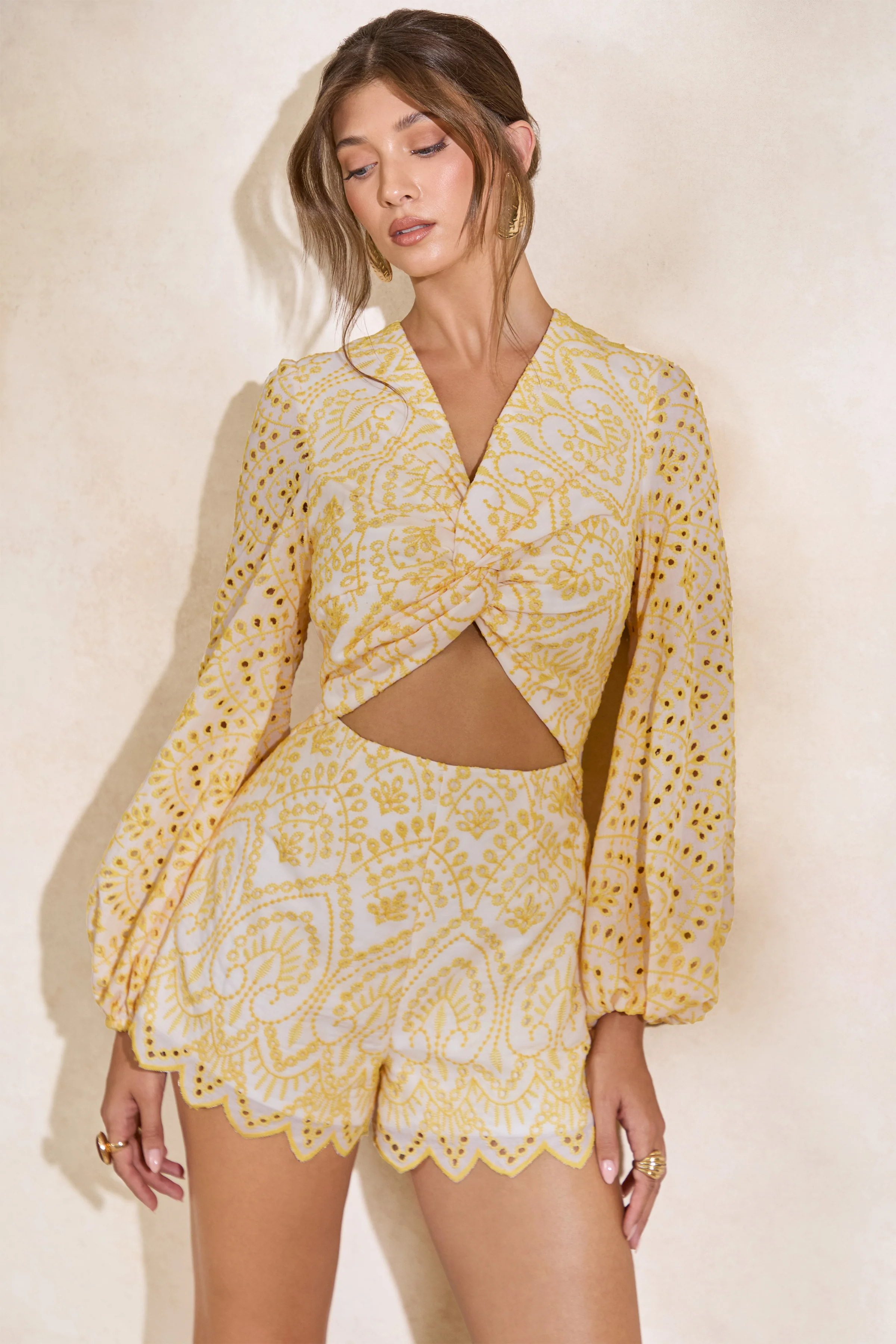 Ksenia | Lemon and White Broderie Plunge-Neck Romper With Twist Detail