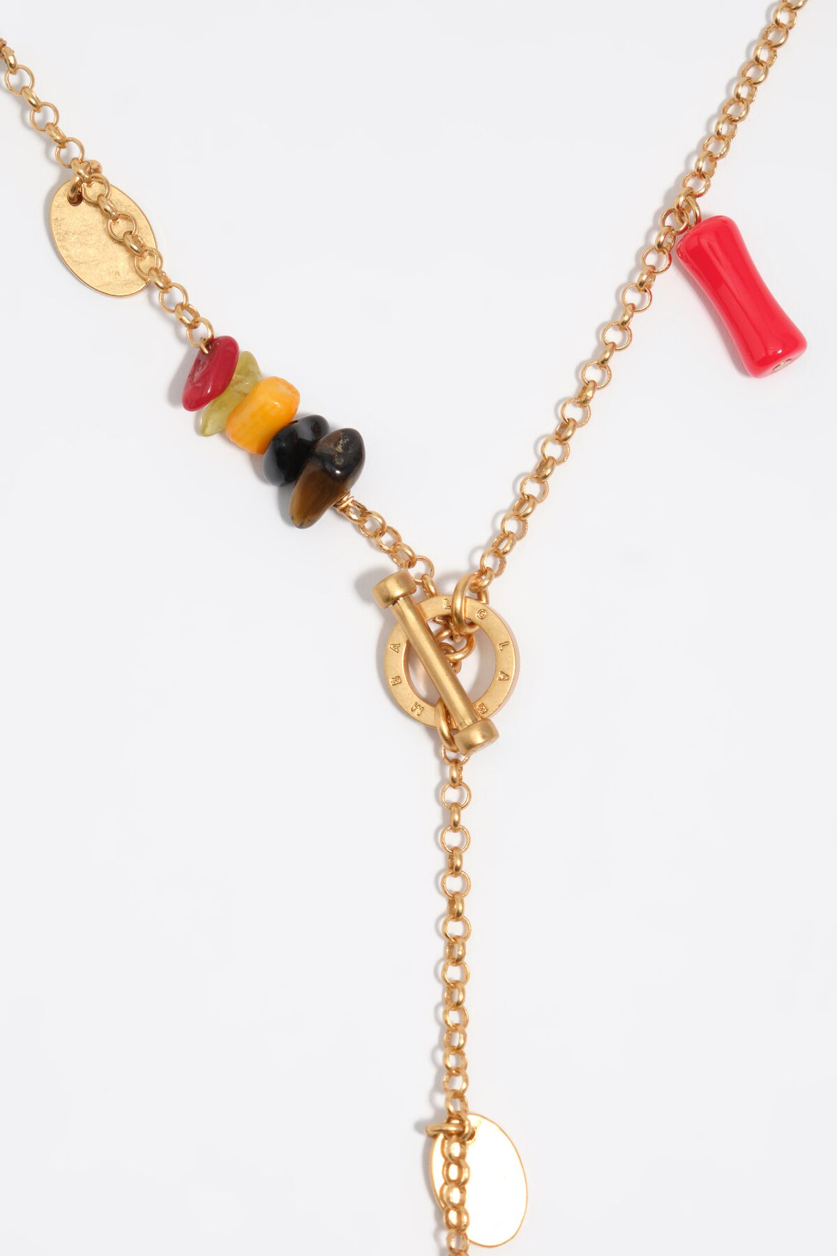 Aged gold necklace with stones and shells