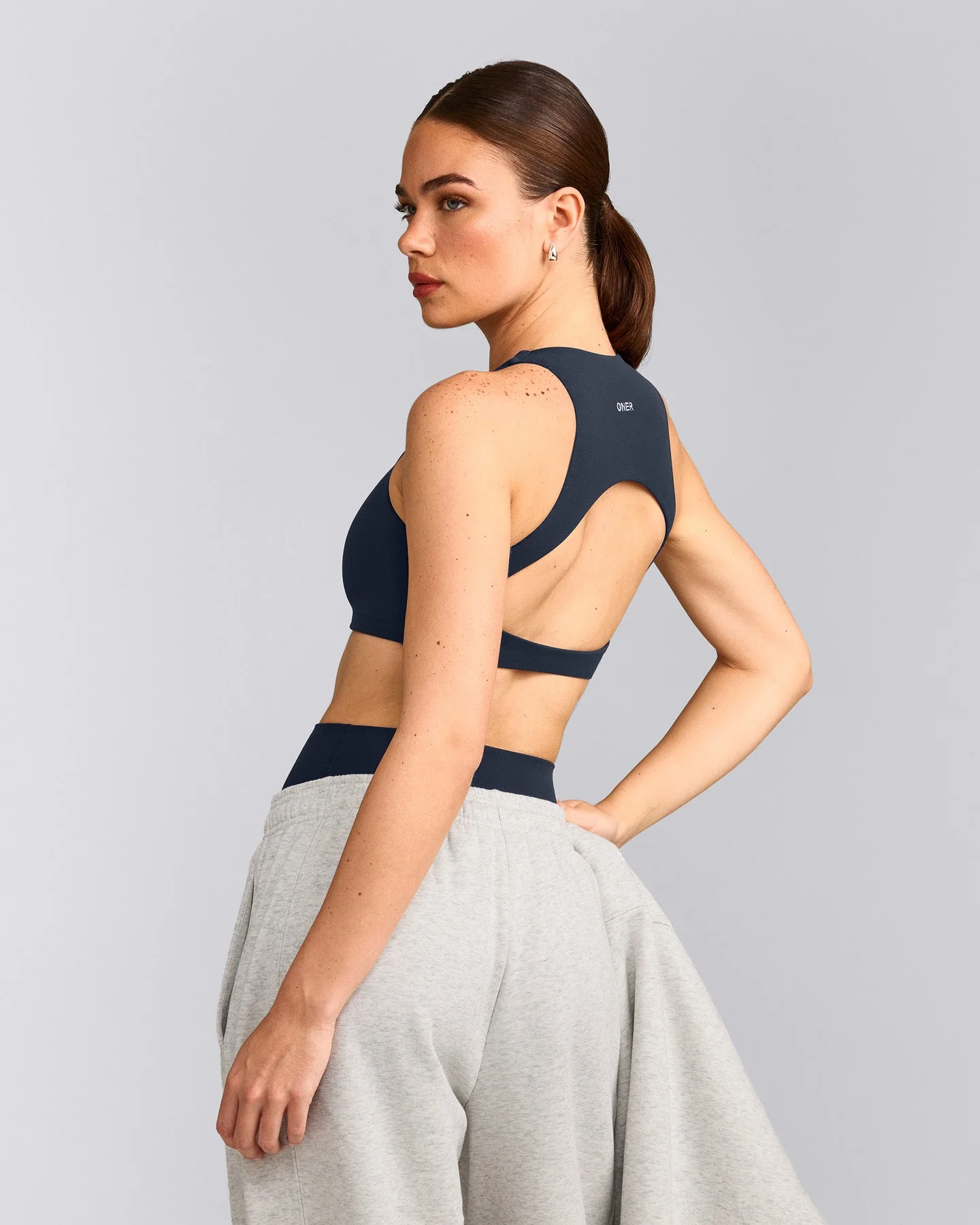 SoftMotion™ High Neck Sports Bra with Grey Logo | True Blue