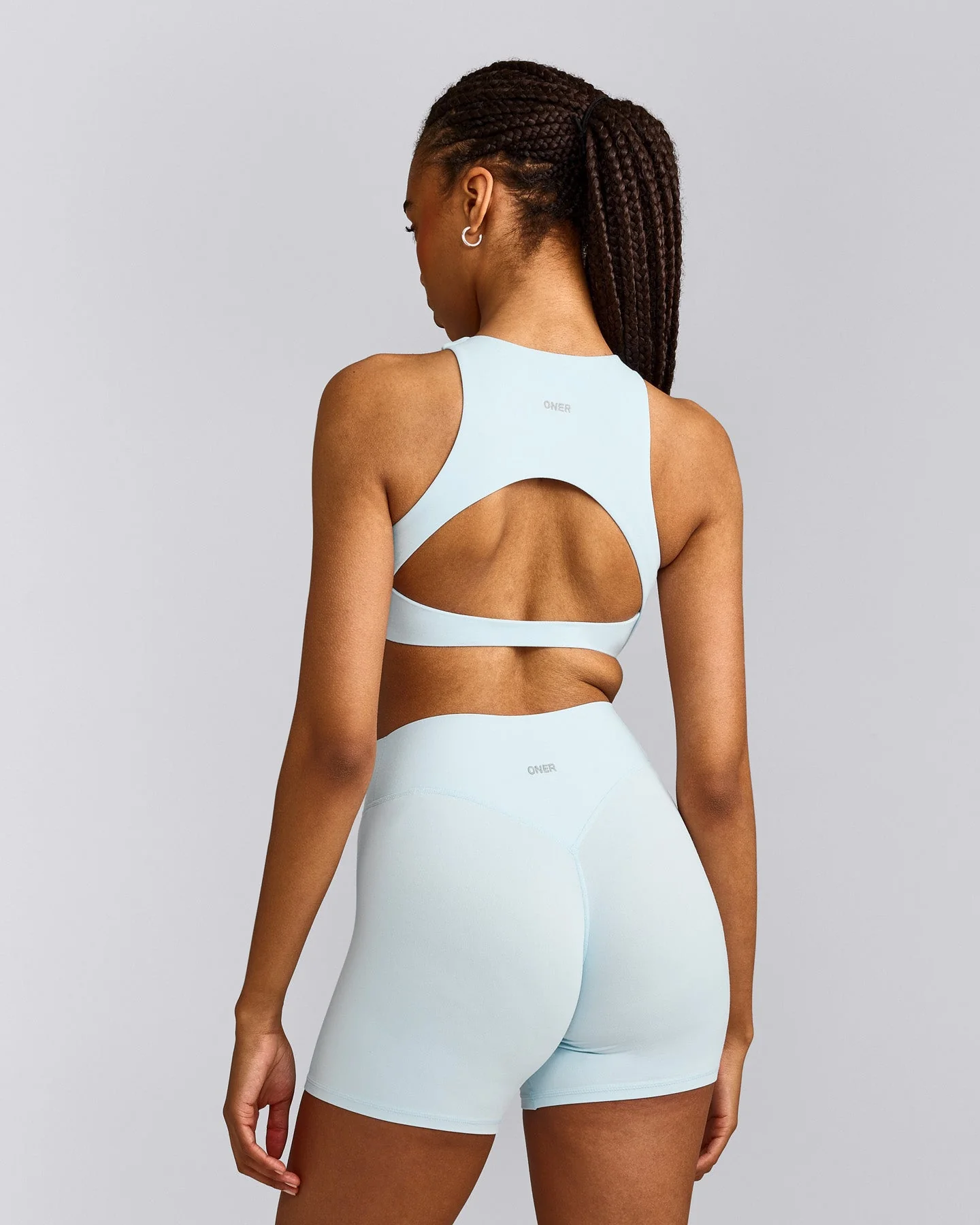 SoftMotion™ High Neck Sports Bra with Grey Logo | Cloud Blue